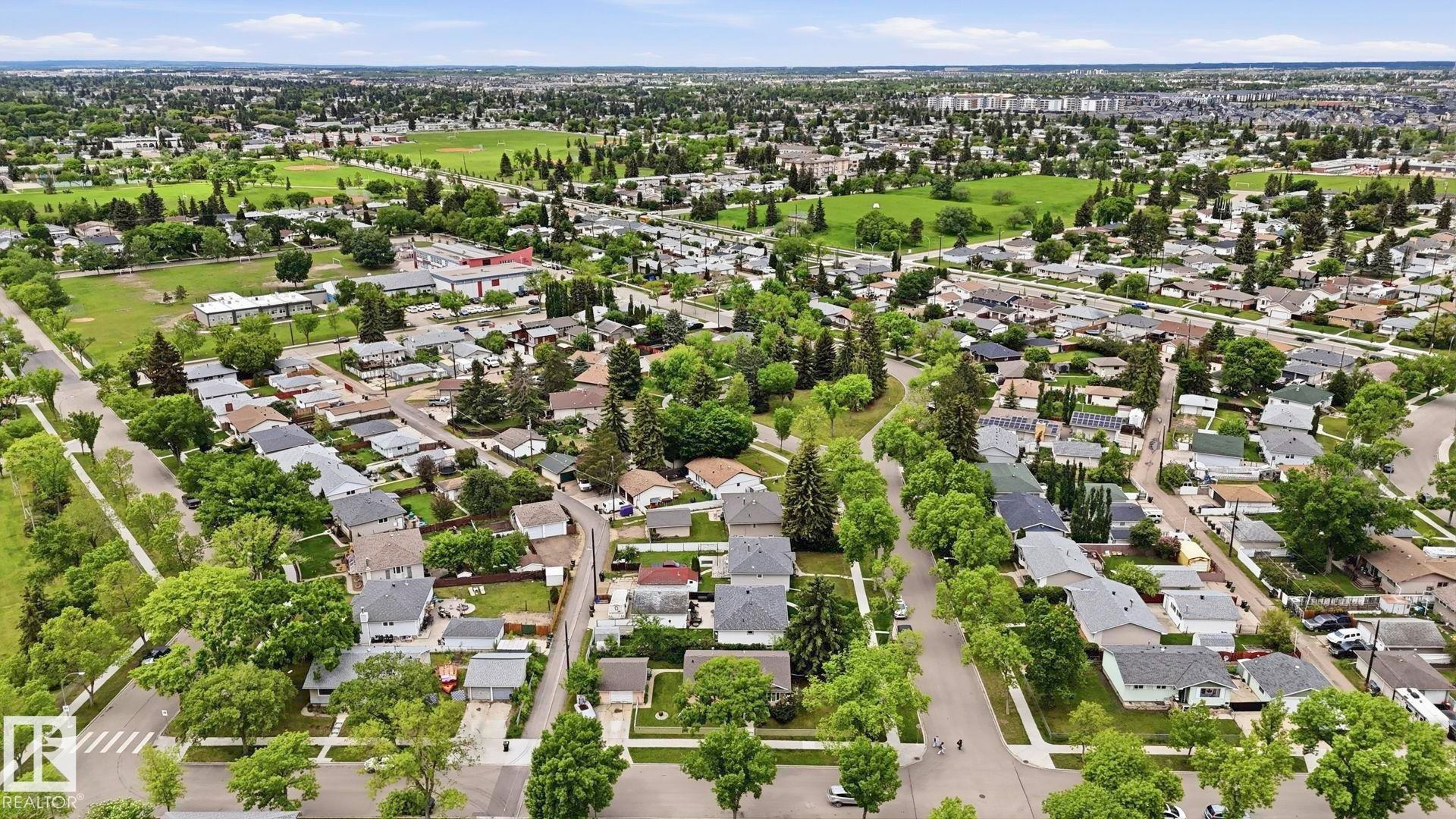 Aerial depiction of a residential area with extensive green spaces and mature tree canopies - 13008 105 Street Nw, Edmonton, AB - Outdoor With View