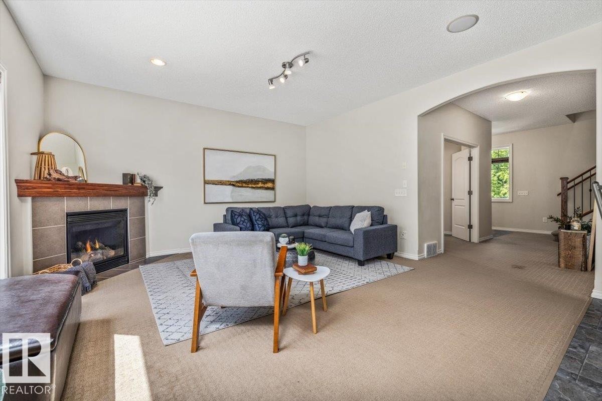 3056 Spence Wynd Sw, Edmonton, AB - Indoor Photo Showing Other Room With Fireplace