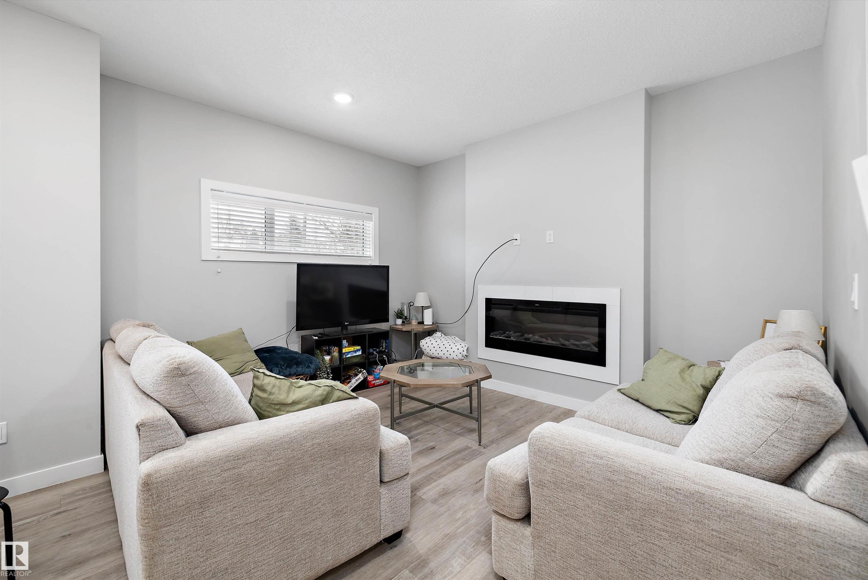 7419 106 Street Nw, Edmonton, AB - Indoor Photo Showing Living Room With Fireplace