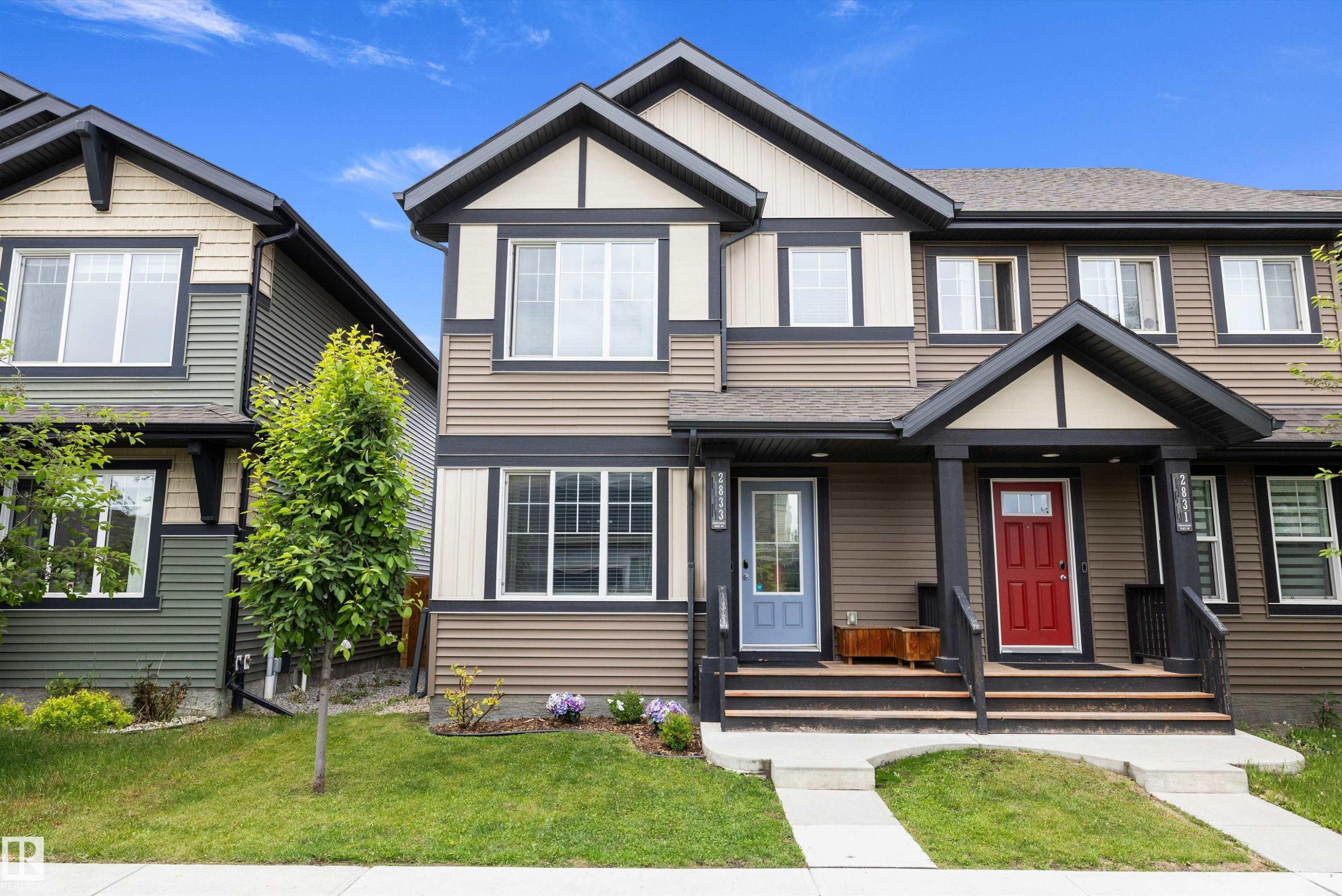 Contemporary multi-unit dwelling with a combination of horizontal siding and vertical accents - 2833 Chokecherry Place, Edmonton, AB