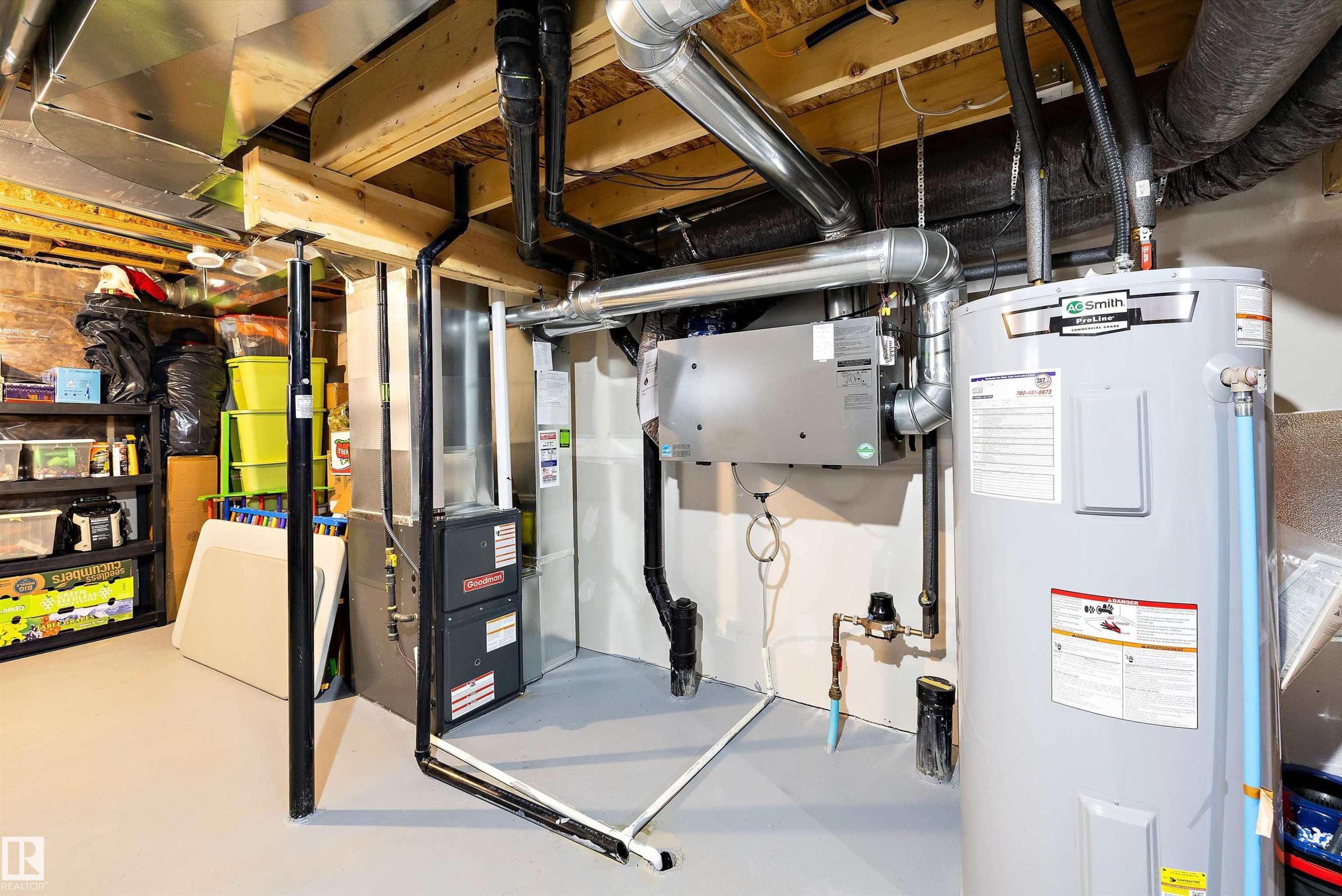 Utility room with exposed ceiling joists, a water heater, furnace, and visible ductwork - 2833 Chokecherry Place, Edmonton, AB