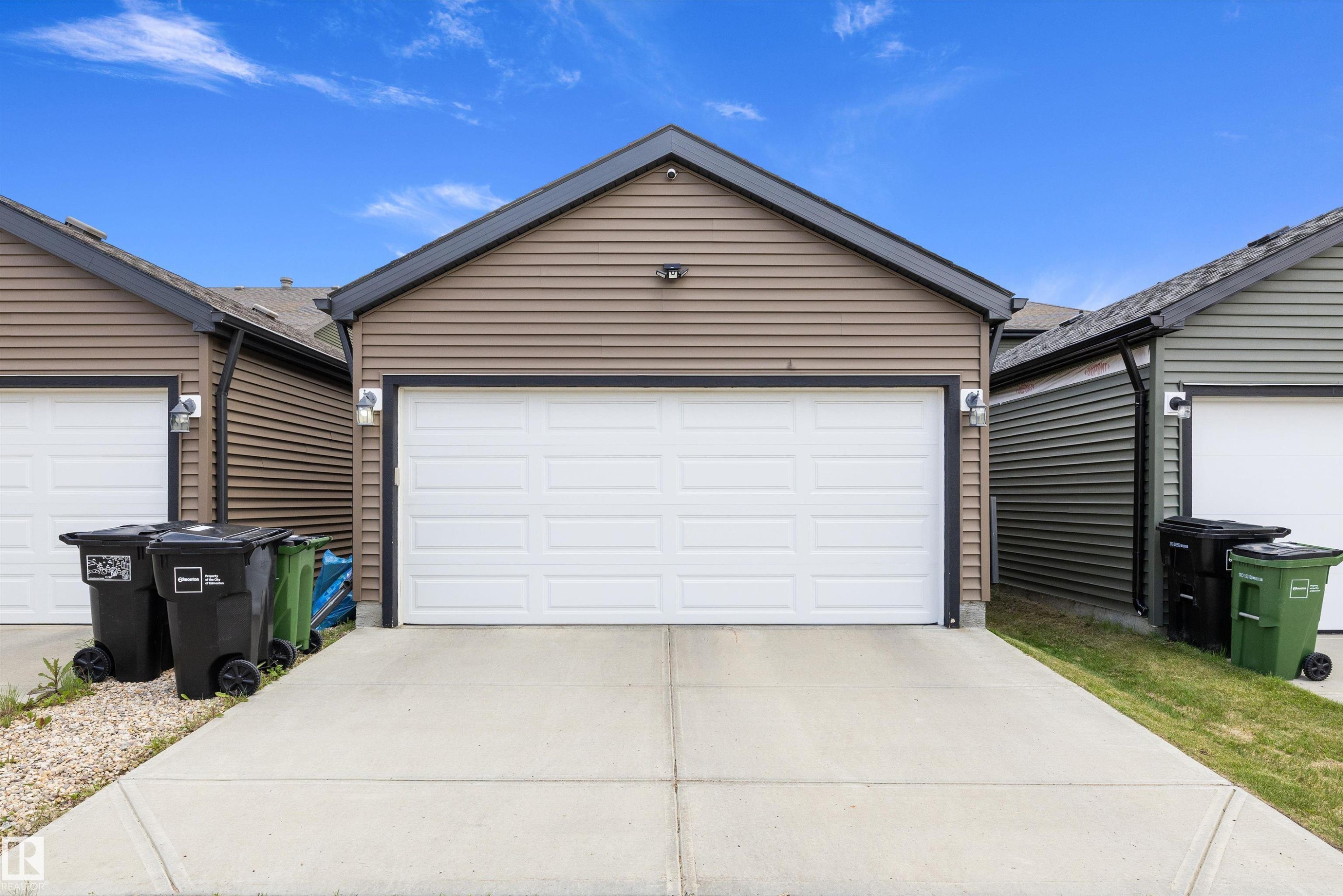 Attached garage with white panel door - 2833 Chokecherry Place, Edmonton, AB