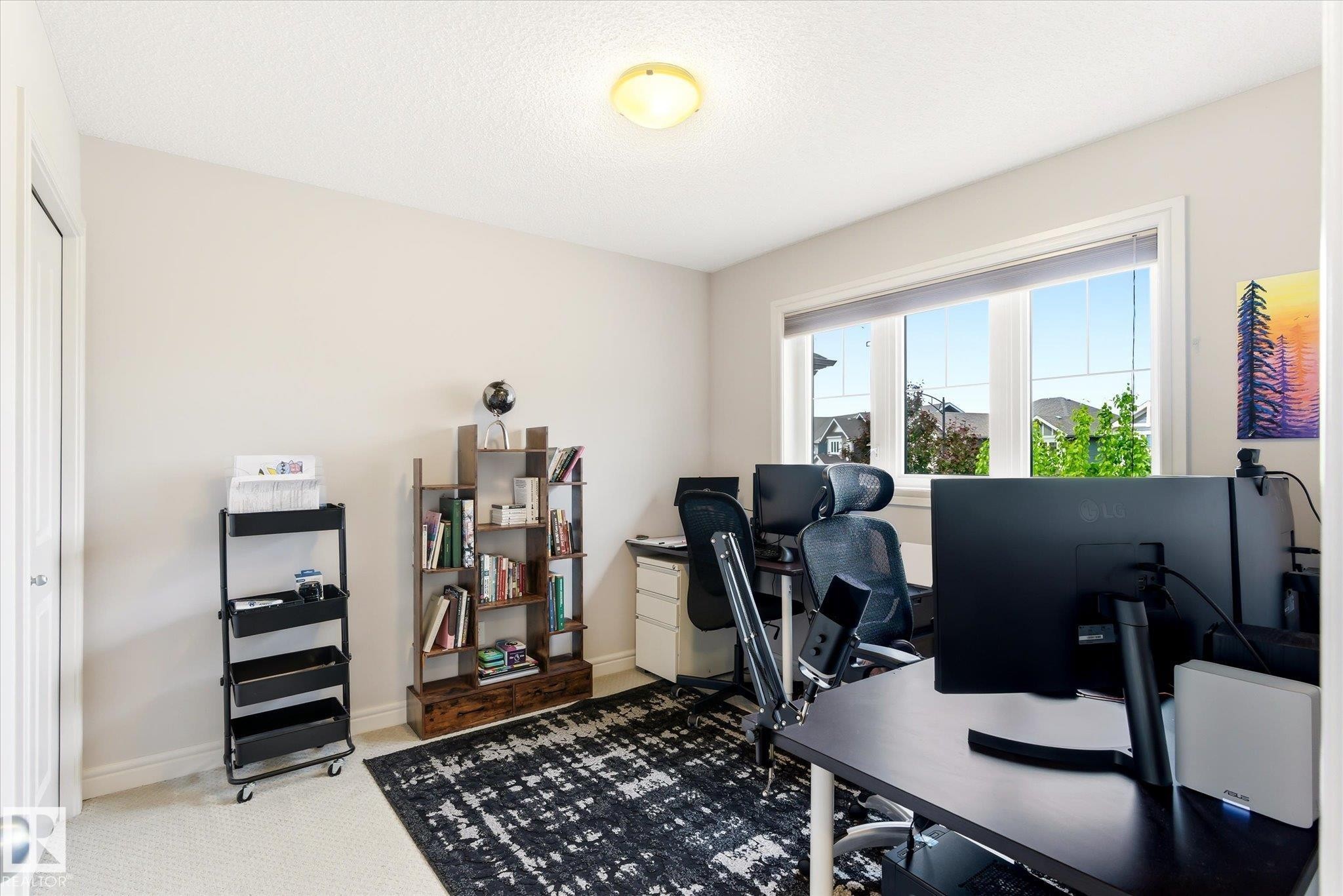 Bright room featuring a large multi-pane window, neutral wall paint, and white trim - 3685 Westcliff Way, Edmonton, AB