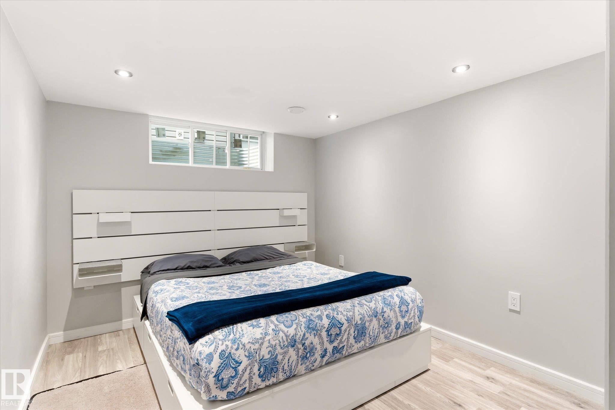 Recessed lighting illuminates this room featuring light wood-finish flooring and a high-set window - 3685 Westcliff Way, Edmonton, AB