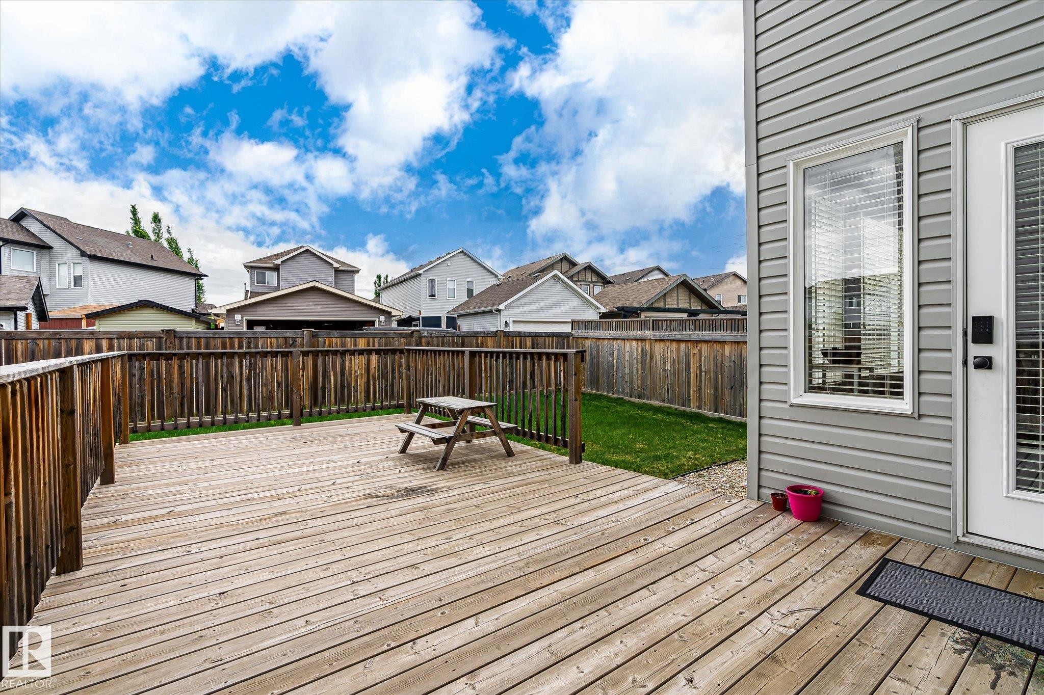 Expansive wooden deck featuring perimeter railing and direct access to the interior - 3685 Westcliff Way, Edmonton, AB