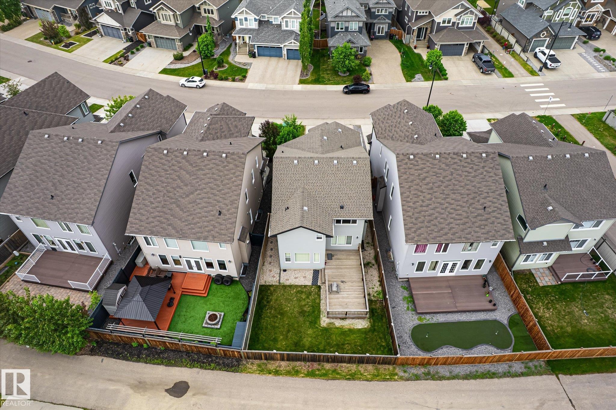 Aerial perspective showcasing residential properties with pitched shingle roofs and fenced backyards - 3685 Westcliff Way, Edmonton, AB