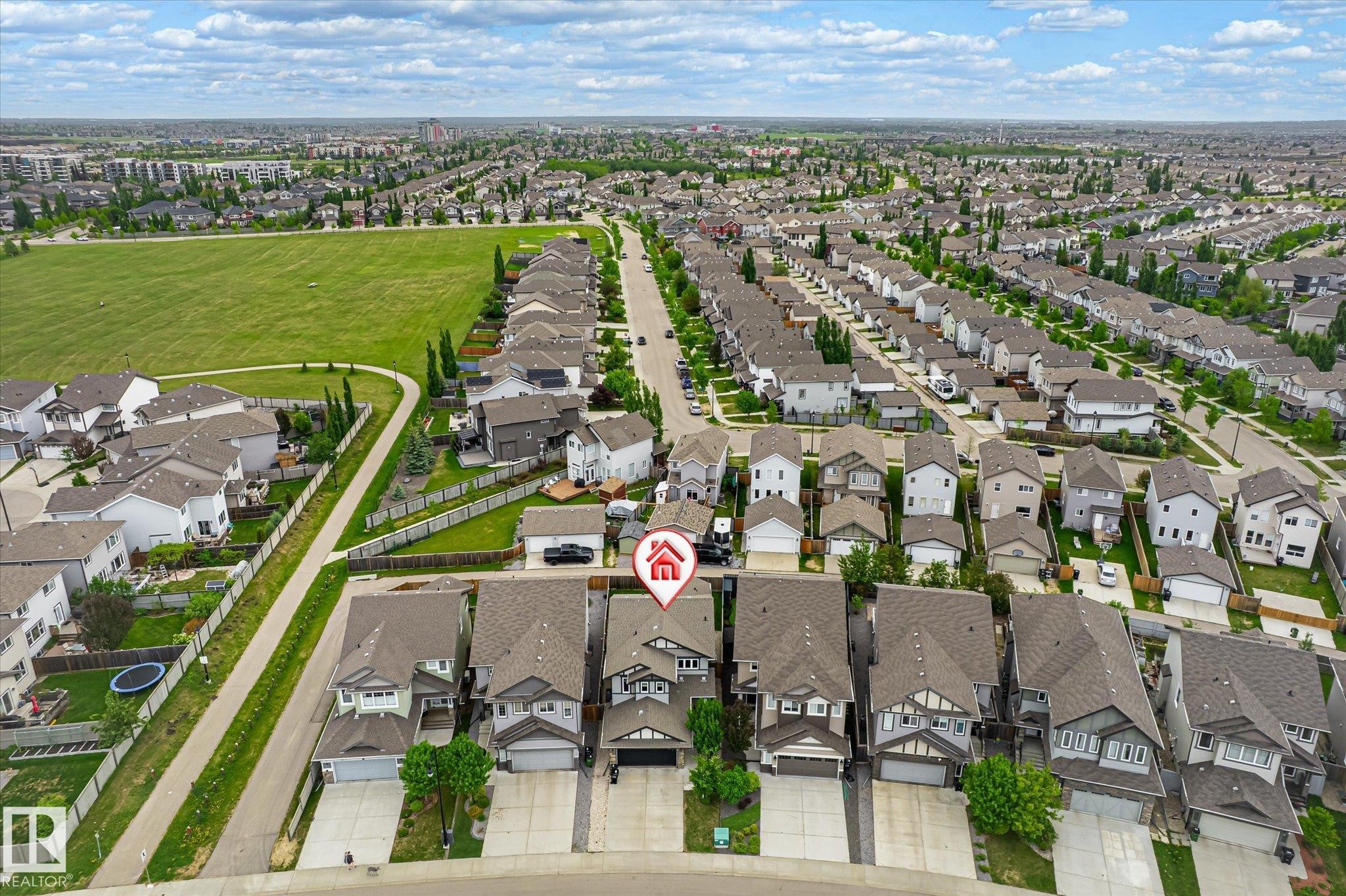 Aerial perspective showcasing a residential neighborhood with single-family homes and a large expanse of green space - 3685 Westcliff Way, Edmonton, AB