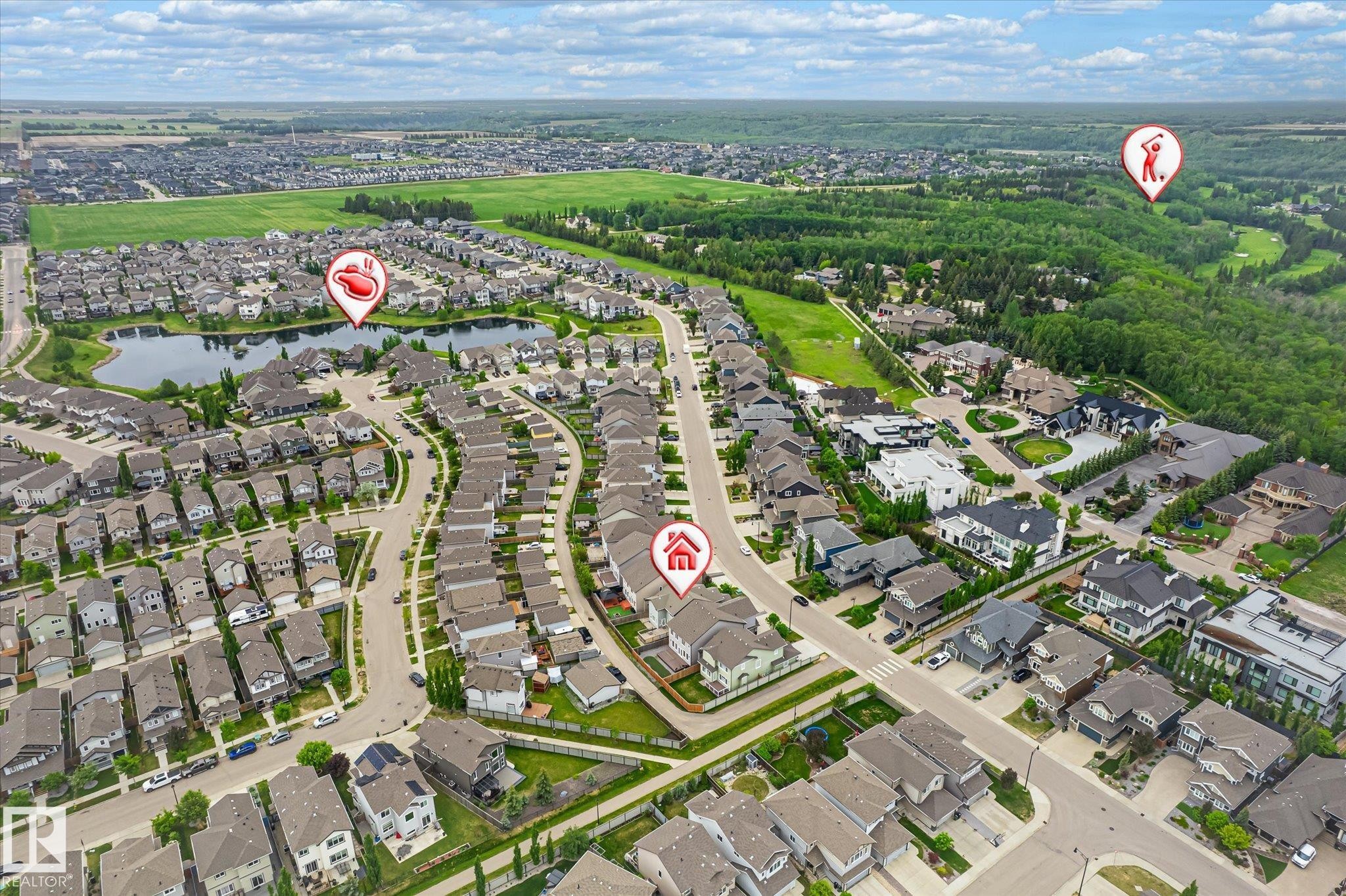 Aerial perspective of a residential community featuring diverse housing styles, curvilinear streets, and extensive green spaces - 3685 Westcliff Way, Edmonton, AB