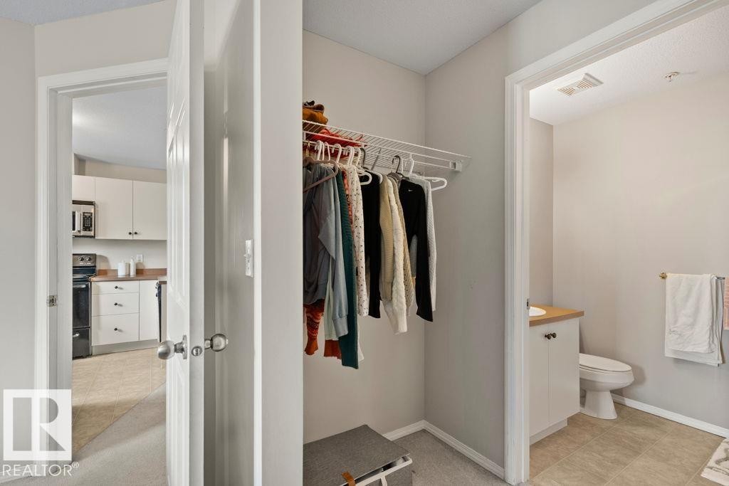 Entryway featuring a built-in closet with wire shelving - 232 4309 33 Street, Stony Plain, AB