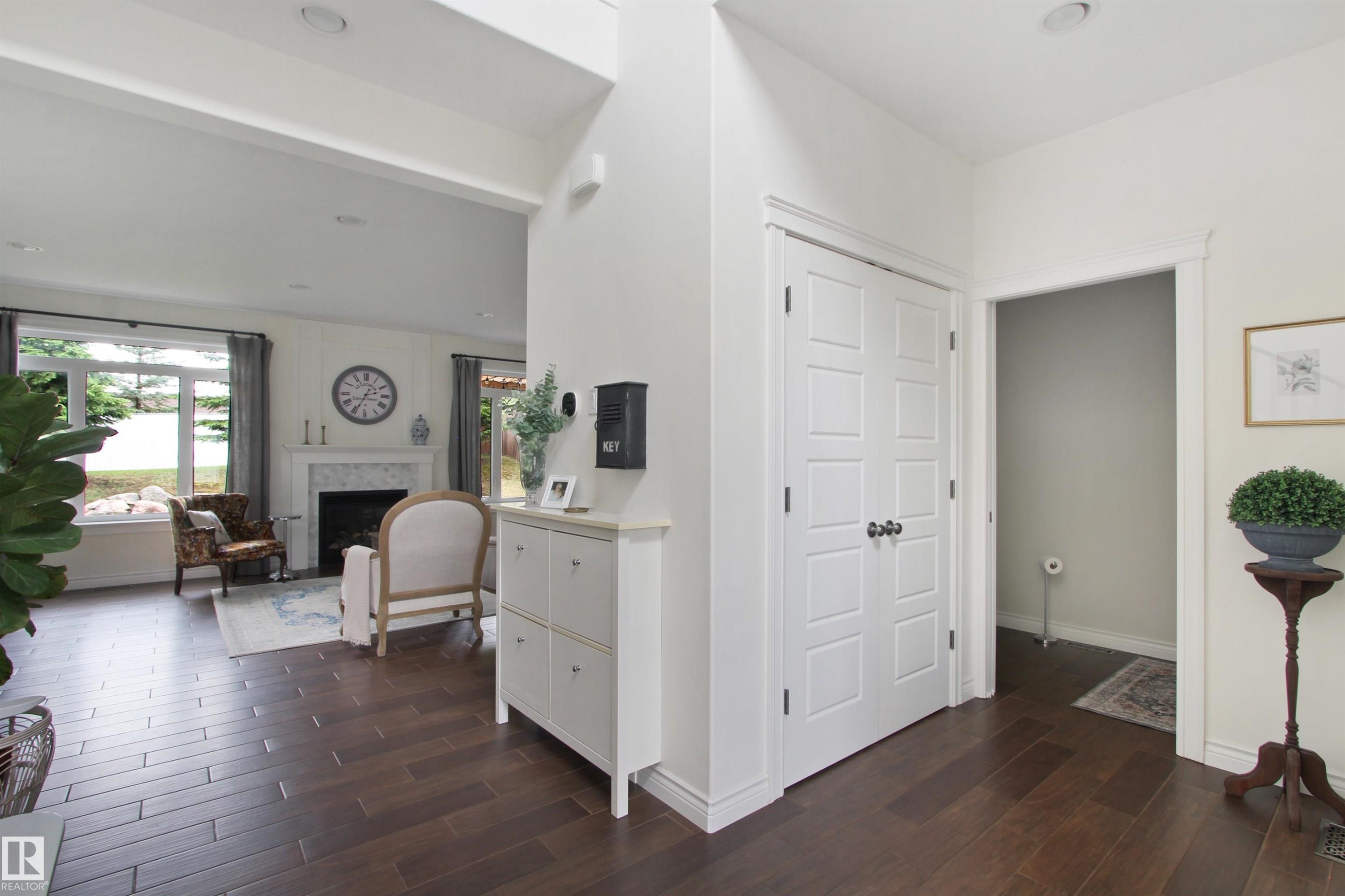 Expansive wood-finish flooring throughout the main level - 34 Falcon Road, Cold Lake, AB