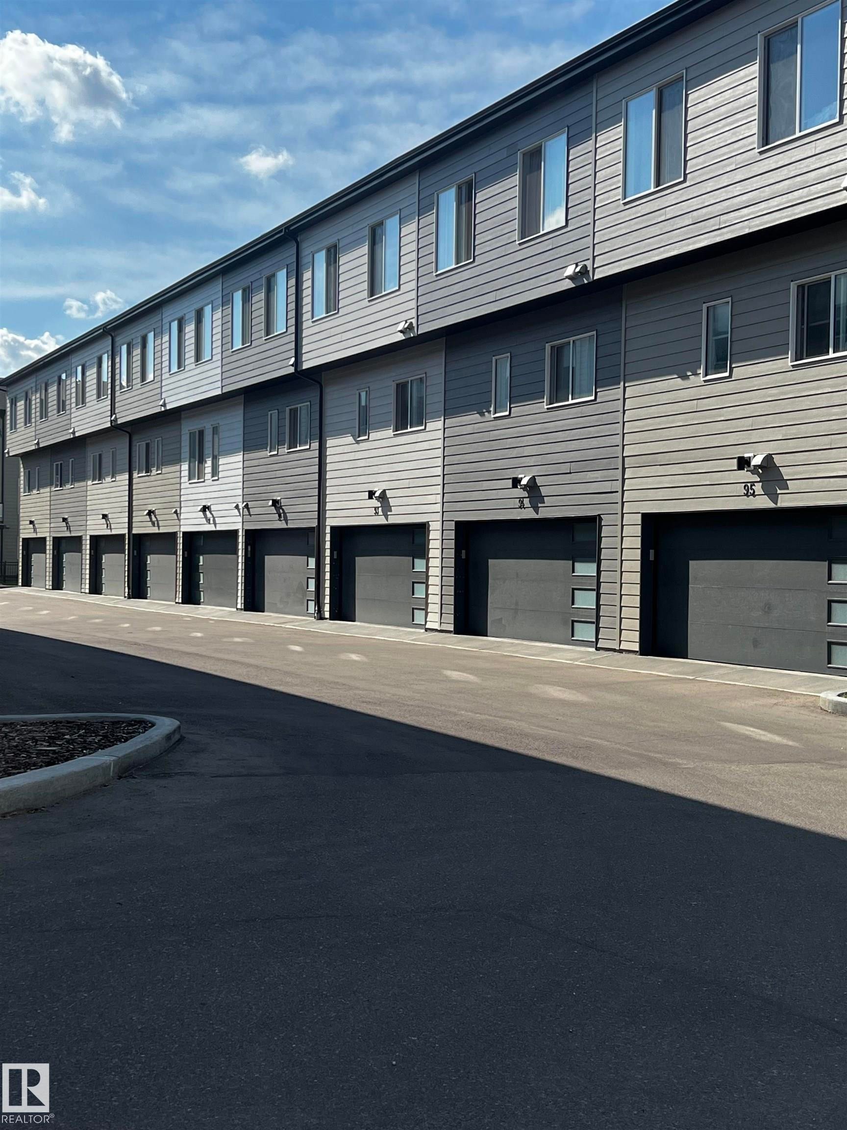Modern multi-level townhome exteriors featuring horizontal siding - 90 804 Welsh Drive, Edmonton, AB