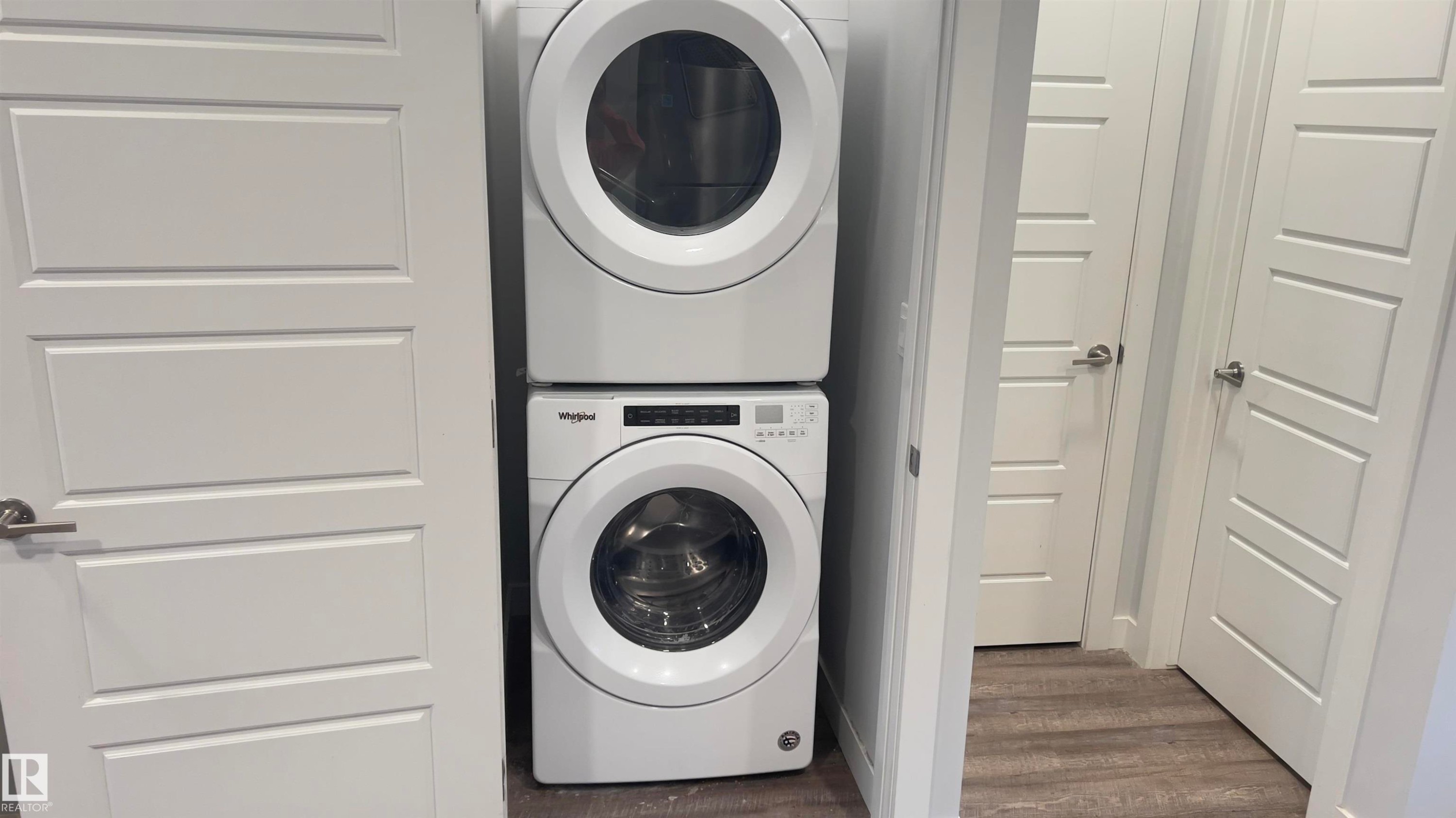 Stacked white washer and dryer unit - 90 804 Welsh Drive, Edmonton, AB