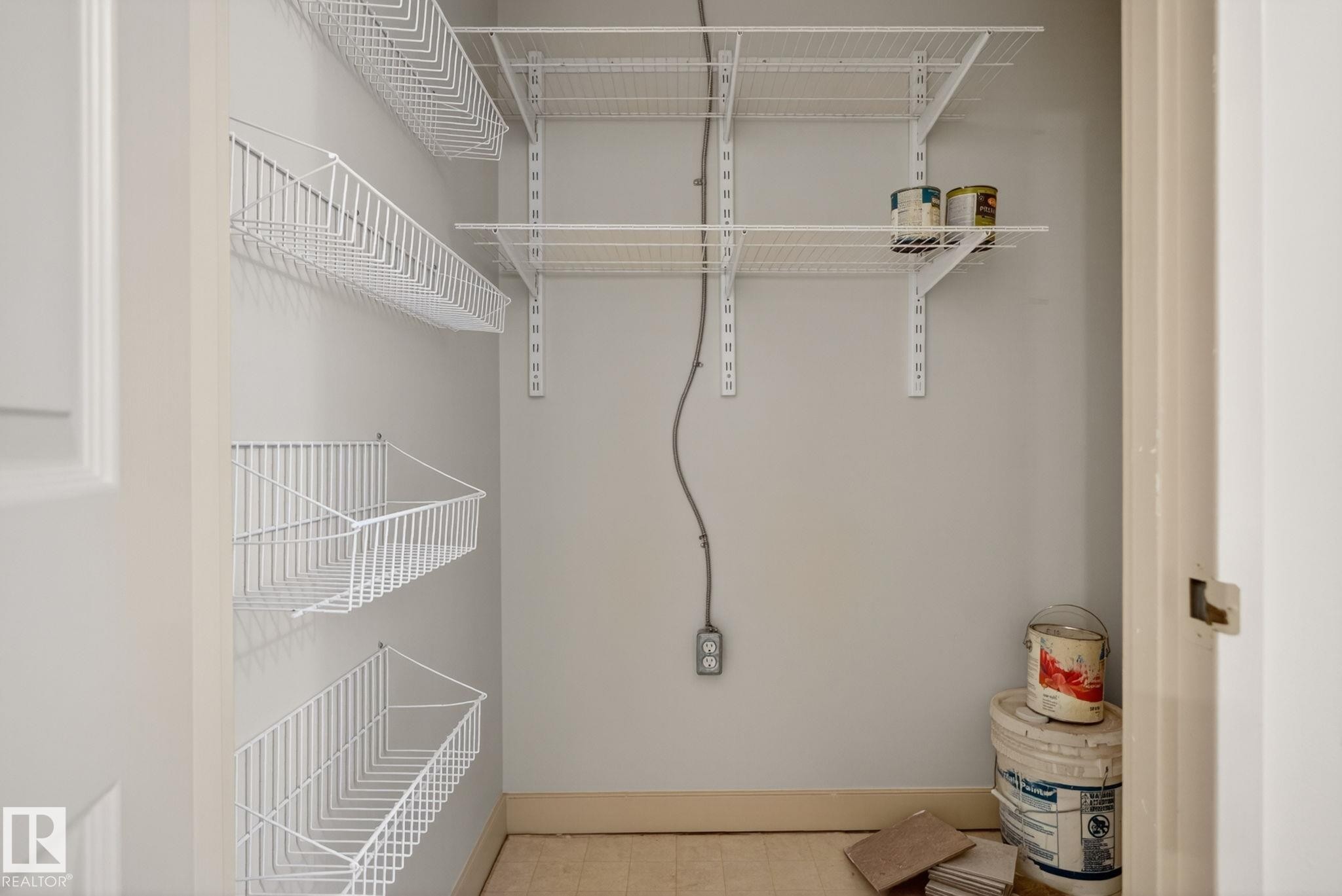 Interior storage area featuring white wire shelving - #412 13910 Stony Plain Rd Nw, Edmonton, AB - Indoor With Storage