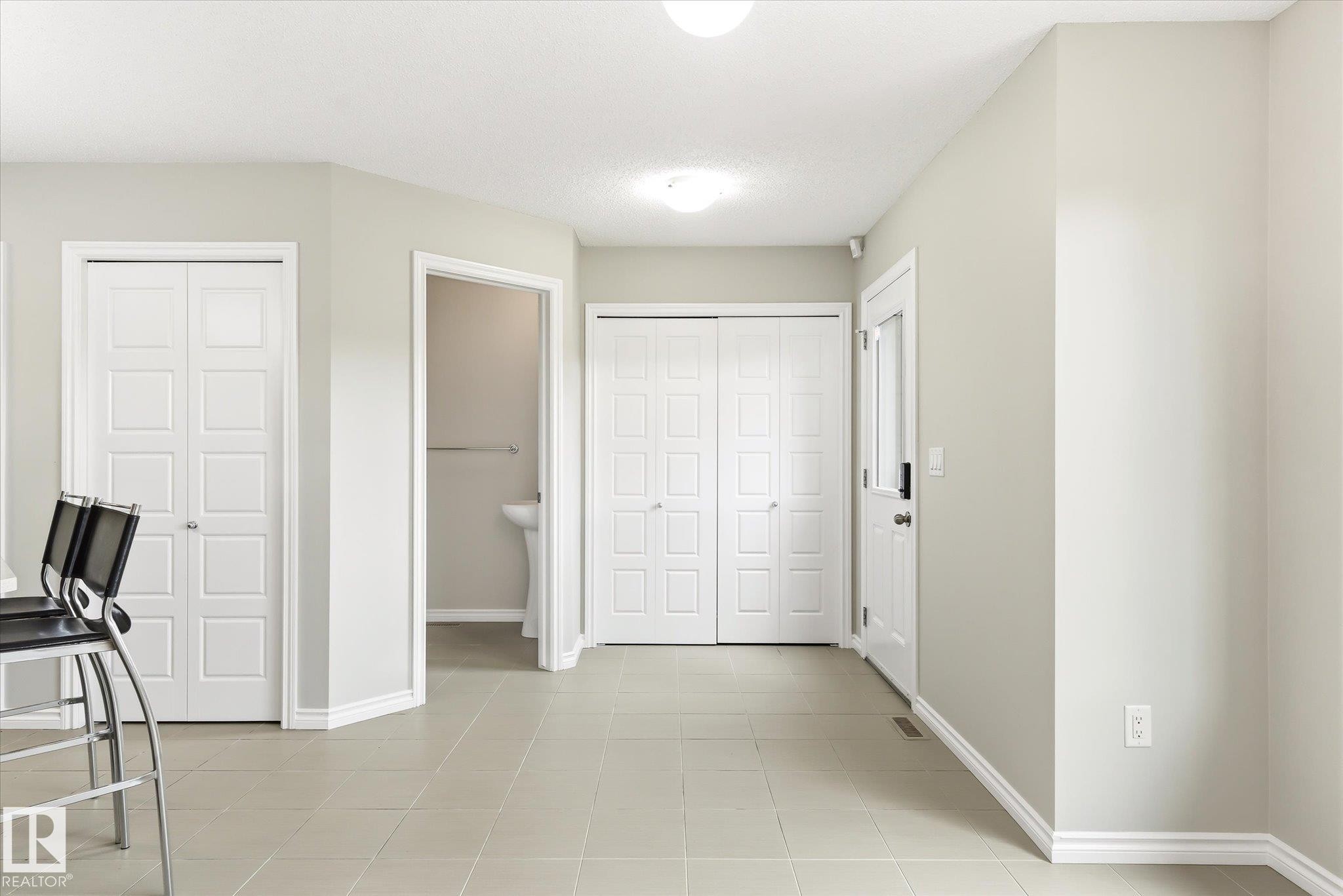 Light-toned tile flooring throughout - 9039 219 Street, Edmonton, AB