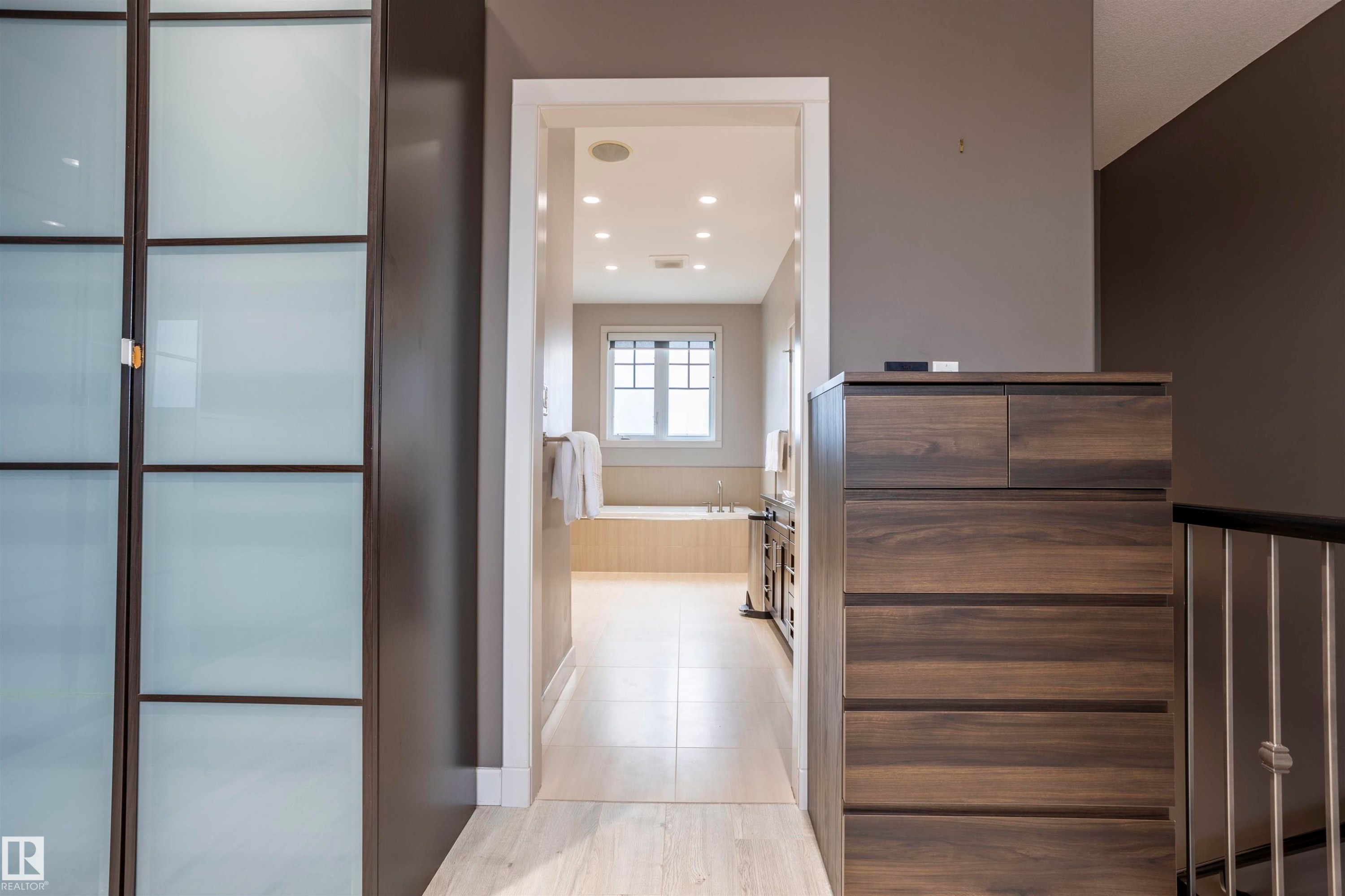 Hallway with light wood-finish flooring - 4949 Terwillegar Common Nw, Edmonton, AB
