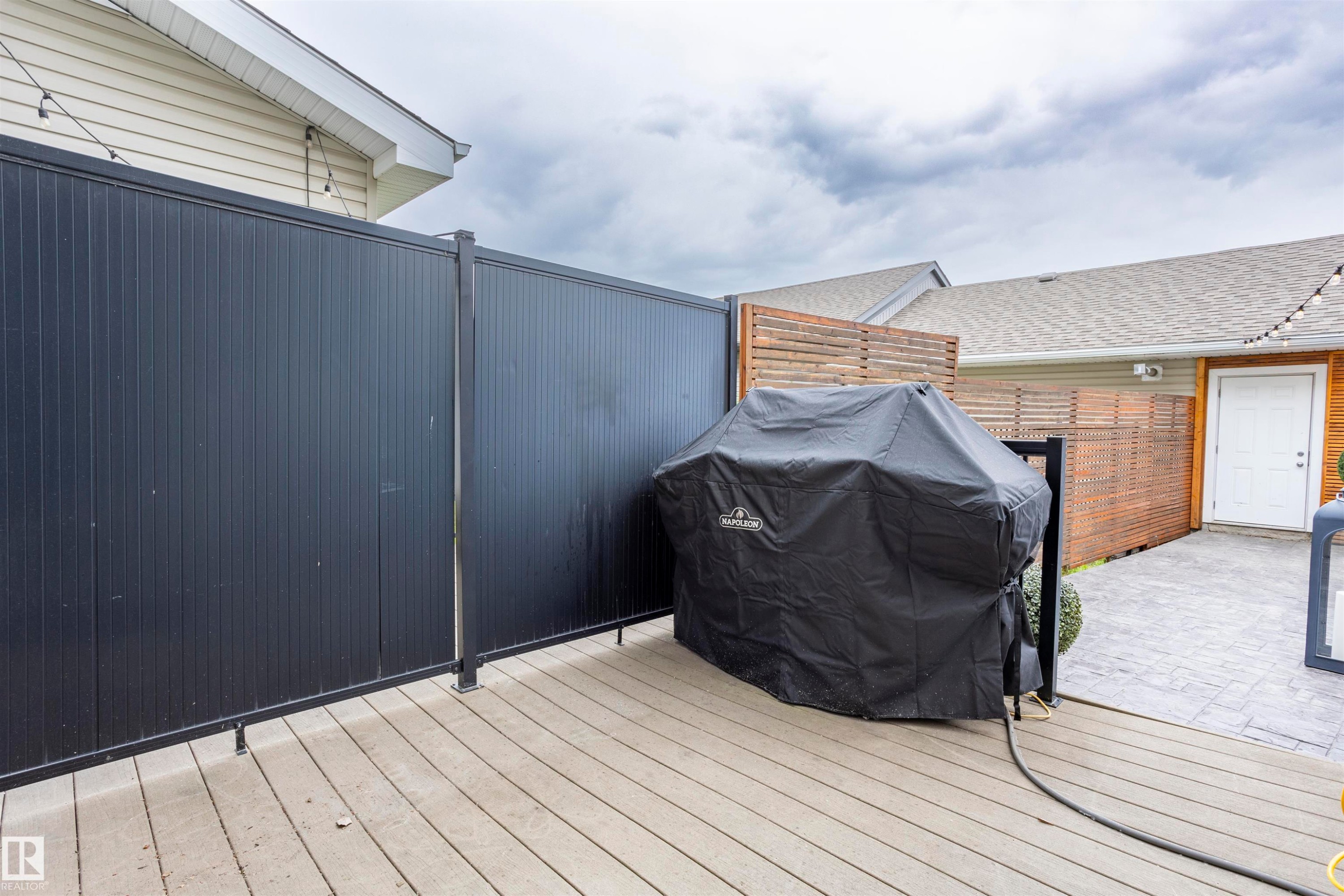 Composite decking with a black privacy fence - 4949 Terwillegar Common Nw, Edmonton, AB