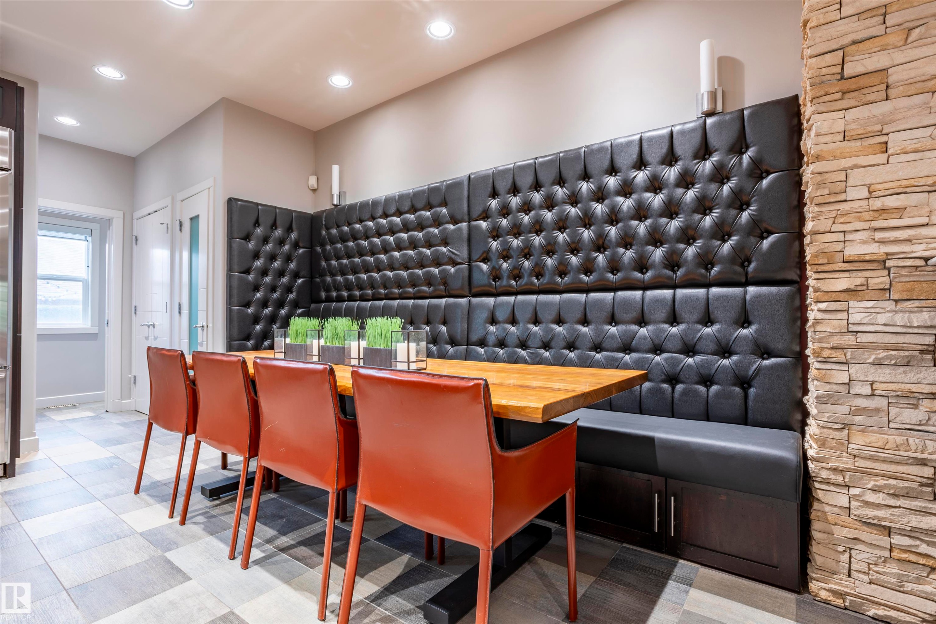 Built-in booth seating with tufted upholstery and integrated storage - 4949 Terwillegar Common Nw, Edmonton, AB