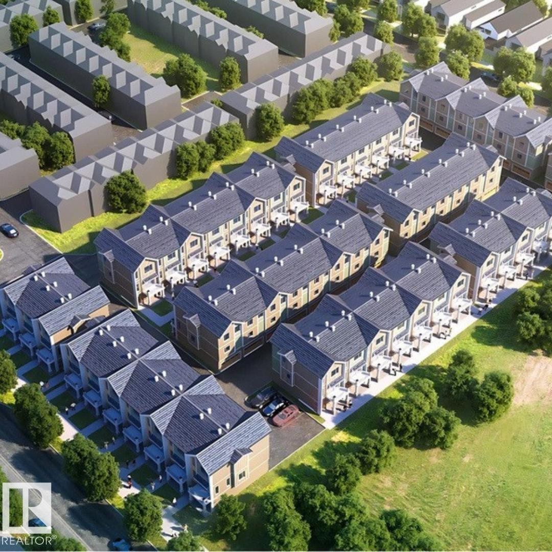 Aerial rendering showcasing a residential development featuring multiple townhome-style buildings - 6 18110 28 Avenue, Edmonton, AB