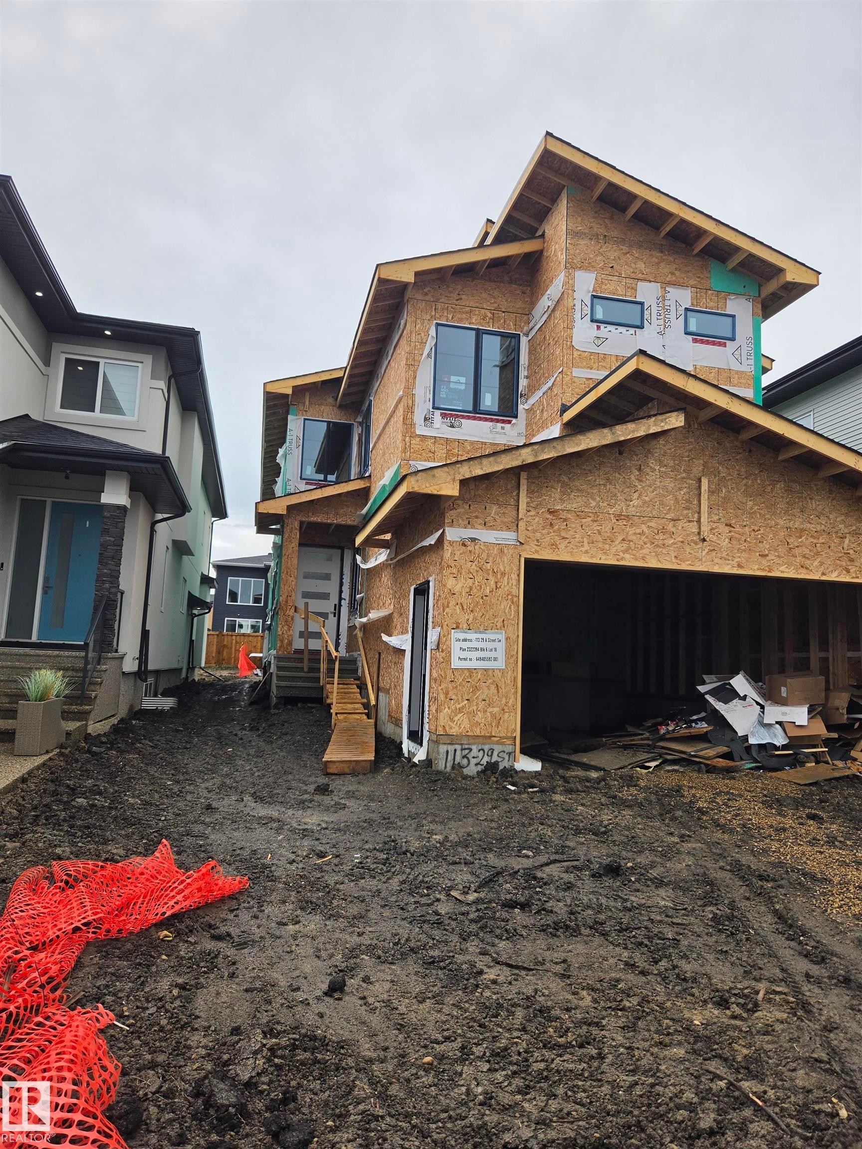 New construction property with contemporary window placement and an attached garage - 113 29A Street, Edmonton, AB