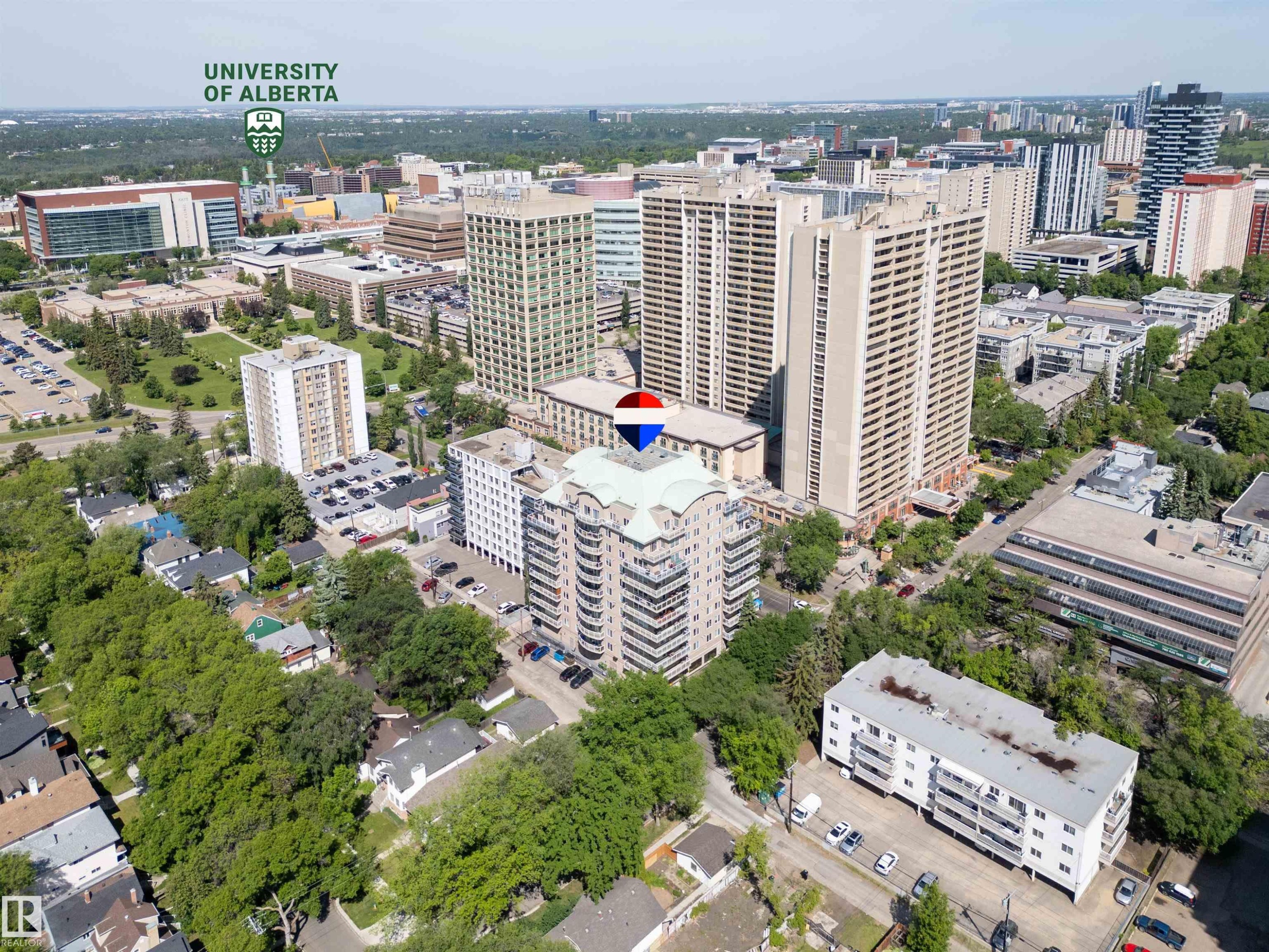 Mid-rise multi-story building featuring a distinctive green roof and multiple balconies - 305 11111 82 Avenue, Edmonton, AB