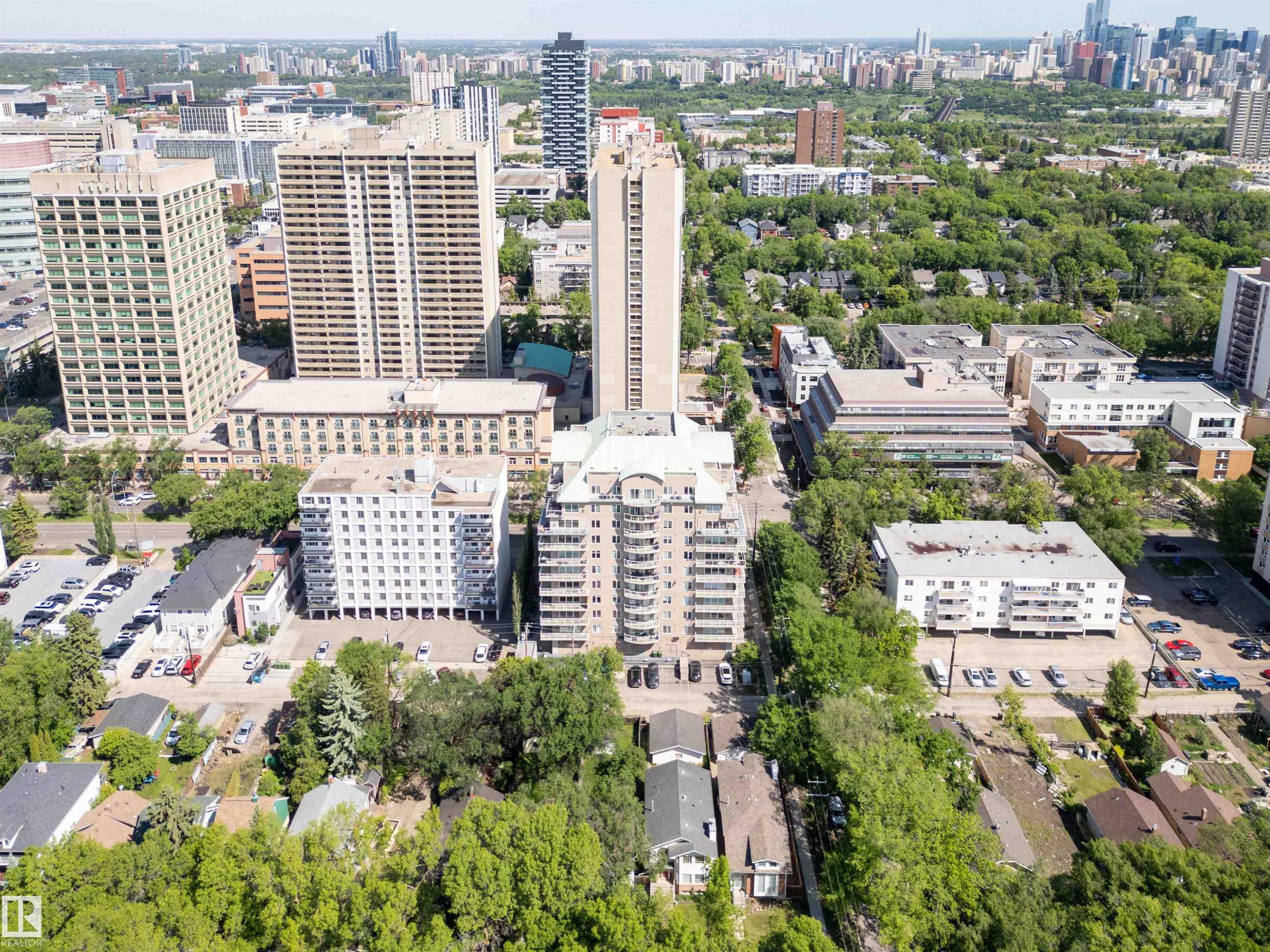 Aerial perspective showcasing an urban landscape with a mix of high-rise buildings and verdant tree-lined streets - 305 11111 82 Avenue, Edmonton, AB