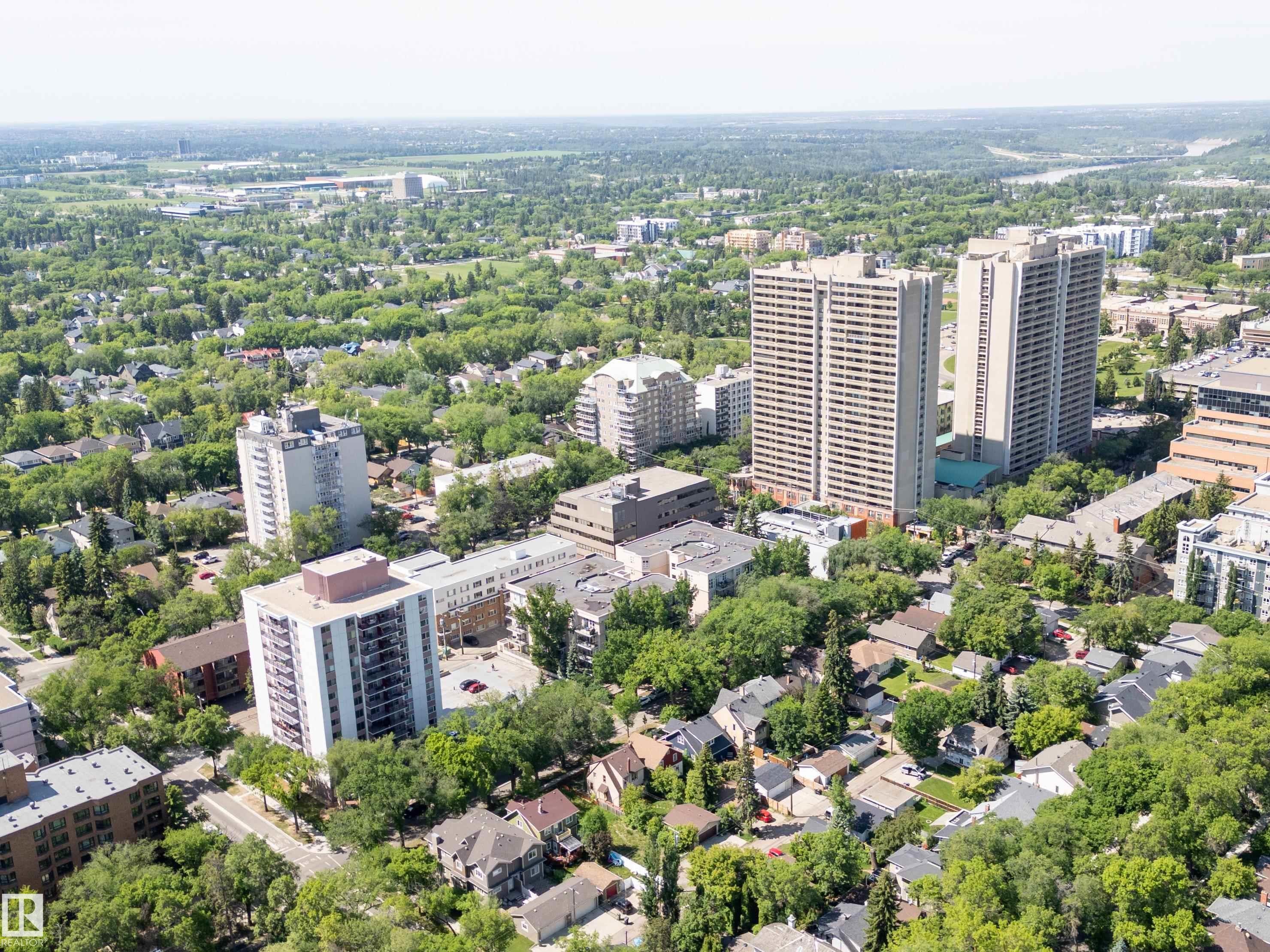 Aerial perspective showcasing a diverse urban landscape with residential and high-rise buildings - 305 11111 82 Avenue, Edmonton, AB