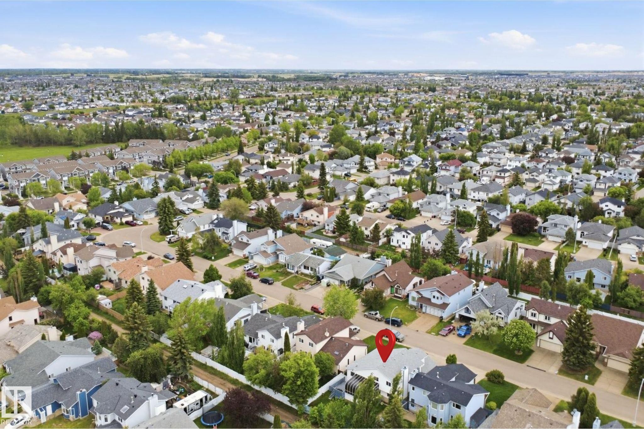 Aerial perspective of an established residential area with mature tree coverage - 3220 42A Avenue, Edmonton, AB