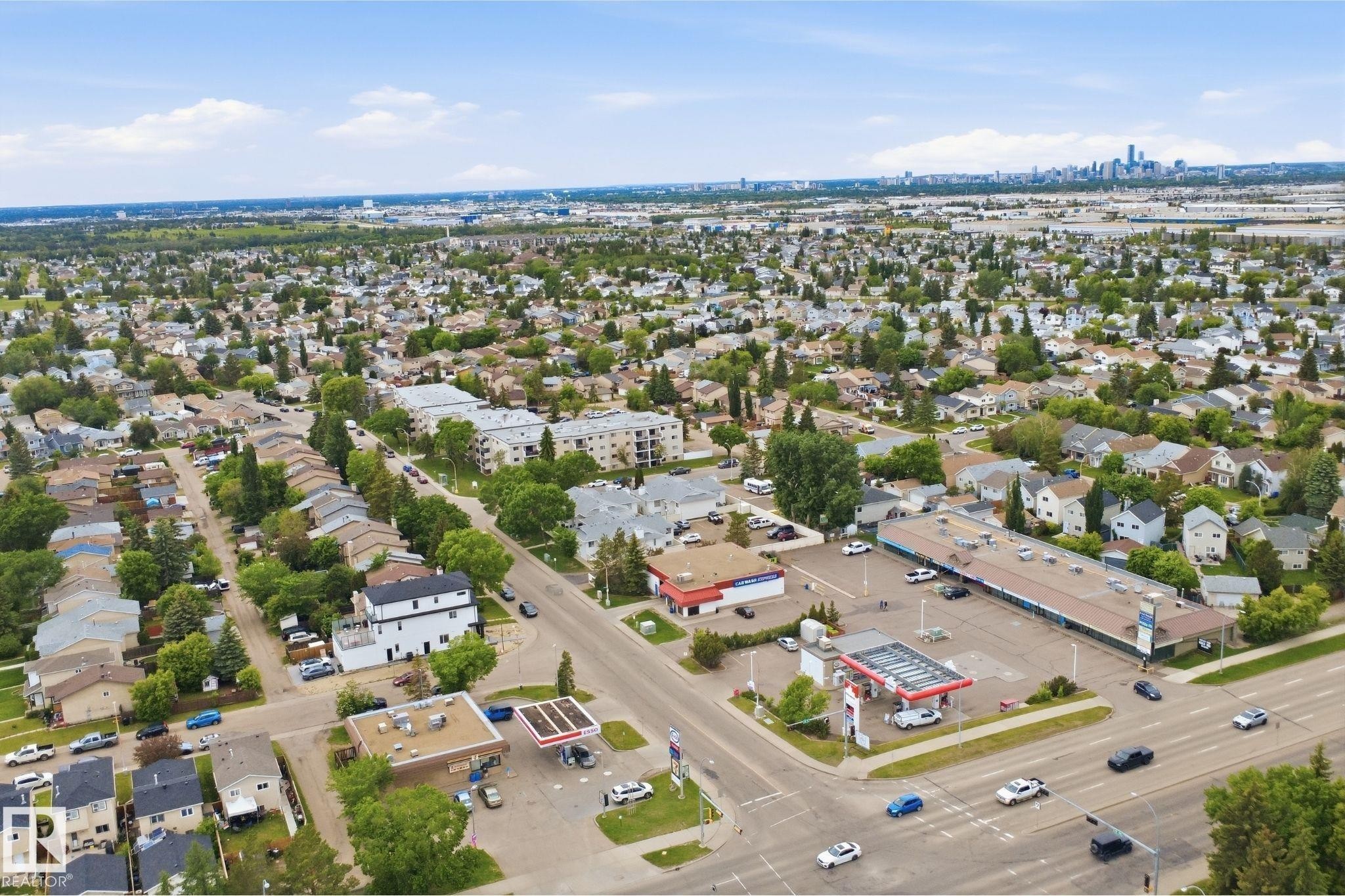 Aerial perspective showcasing a residential neighborhood with mixed-use development - 3220 42A Avenue, Edmonton, AB