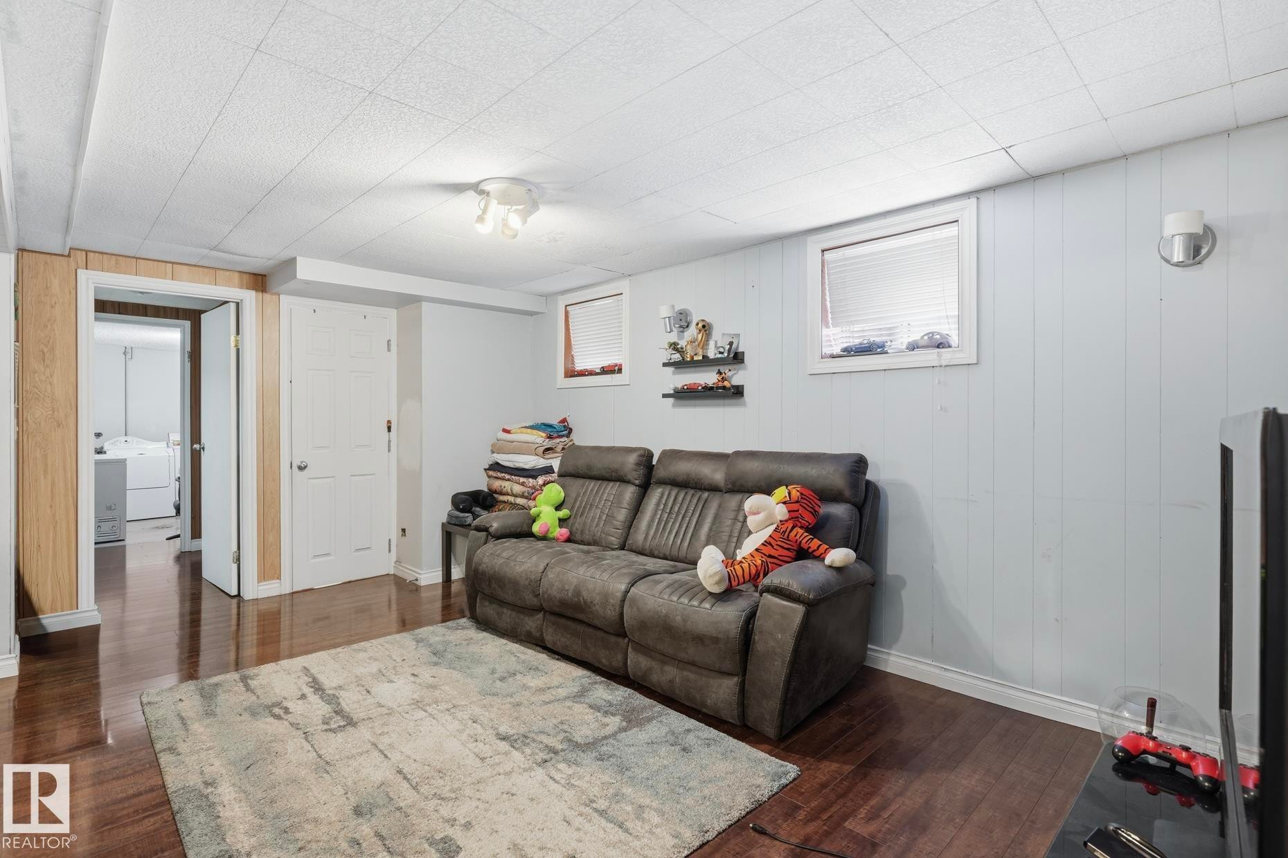 Finished lower level featuring rich wood-finish flooring - 12131 101 Street Nw, Edmonton, AB