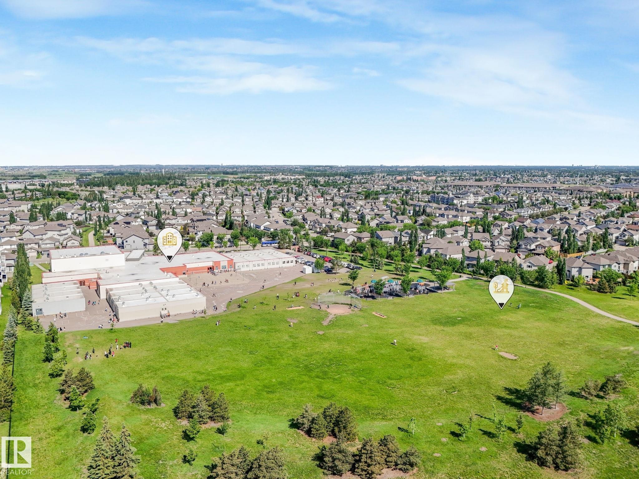 Aerial perspective showcasing a sprawling residential community - 3 1641 James Mowatt Trail, Edmonton, AB