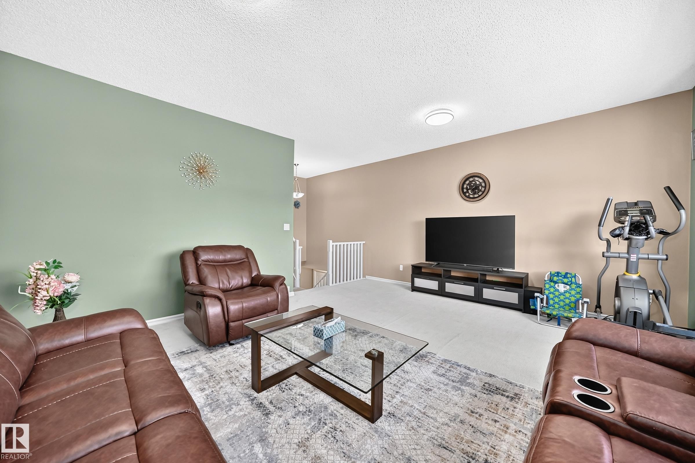 Spacious interior with neutral wall colors and white baseboards - 3224 26 Street, Edmonton, AB