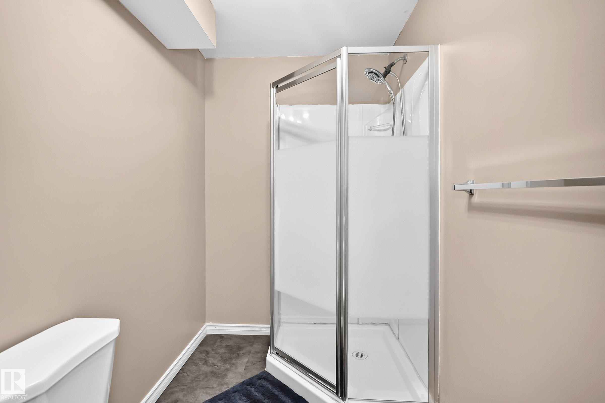 Corner shower enclosure with frosted glass panels and chrome hardware - 3224 26 Street, Edmonton, AB