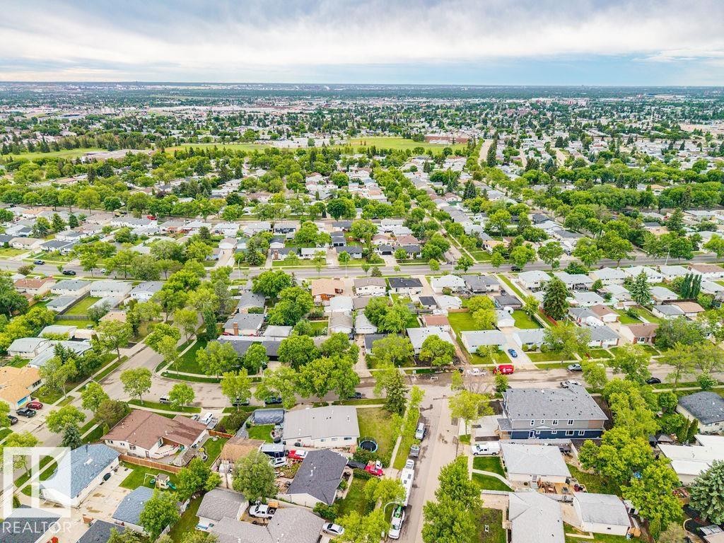 Expansive aerial capturing a vast residential community with numerous detached homes - 6204 150 Avenue Nw, Edmonton, AB