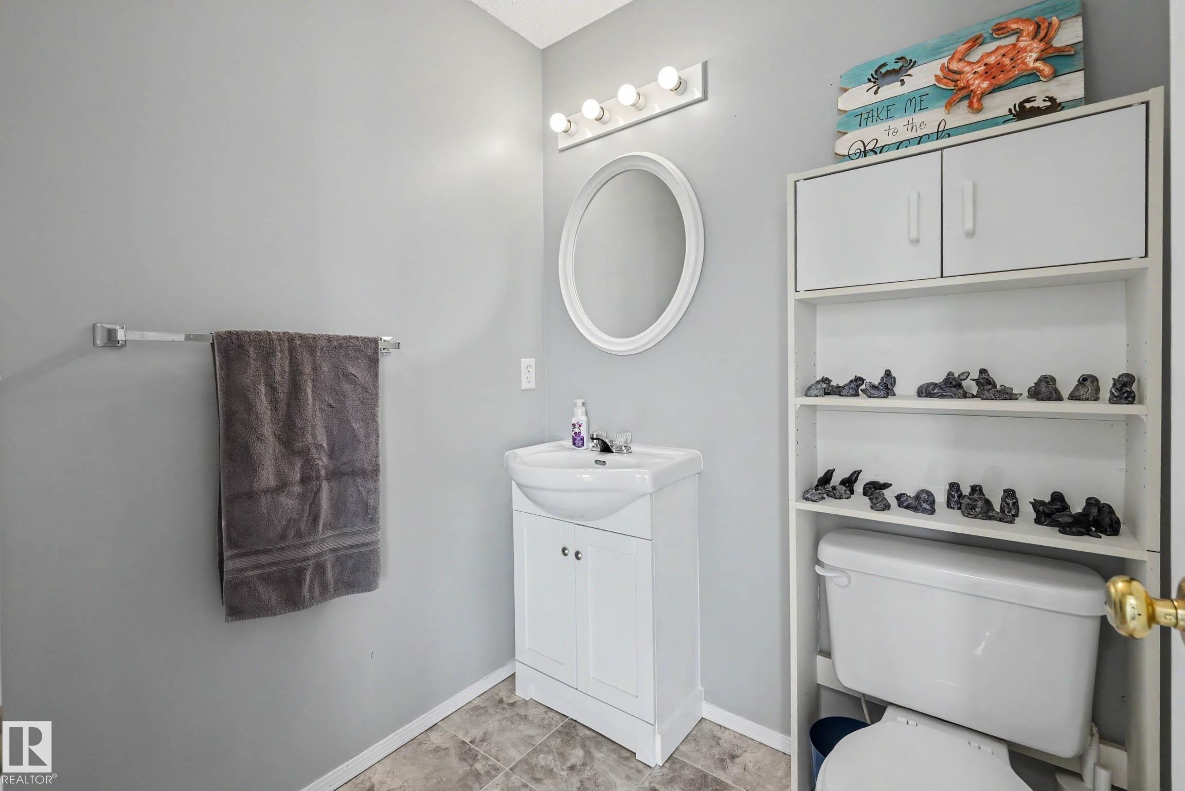 2 piece bathroom by the back door - 2123 36 Avenue, Edmonton, AB - Indoor Photo Showing Bathroom