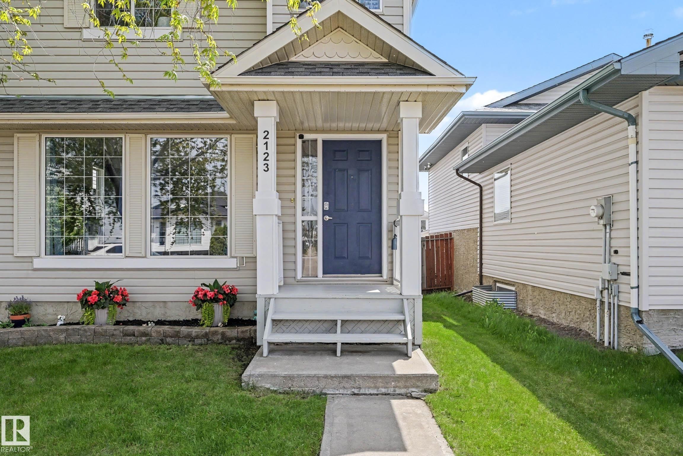 Welcoming facade featuring a covered front entry with white columns - 2123 36 Avenue, Edmonton, AB - Outdoor