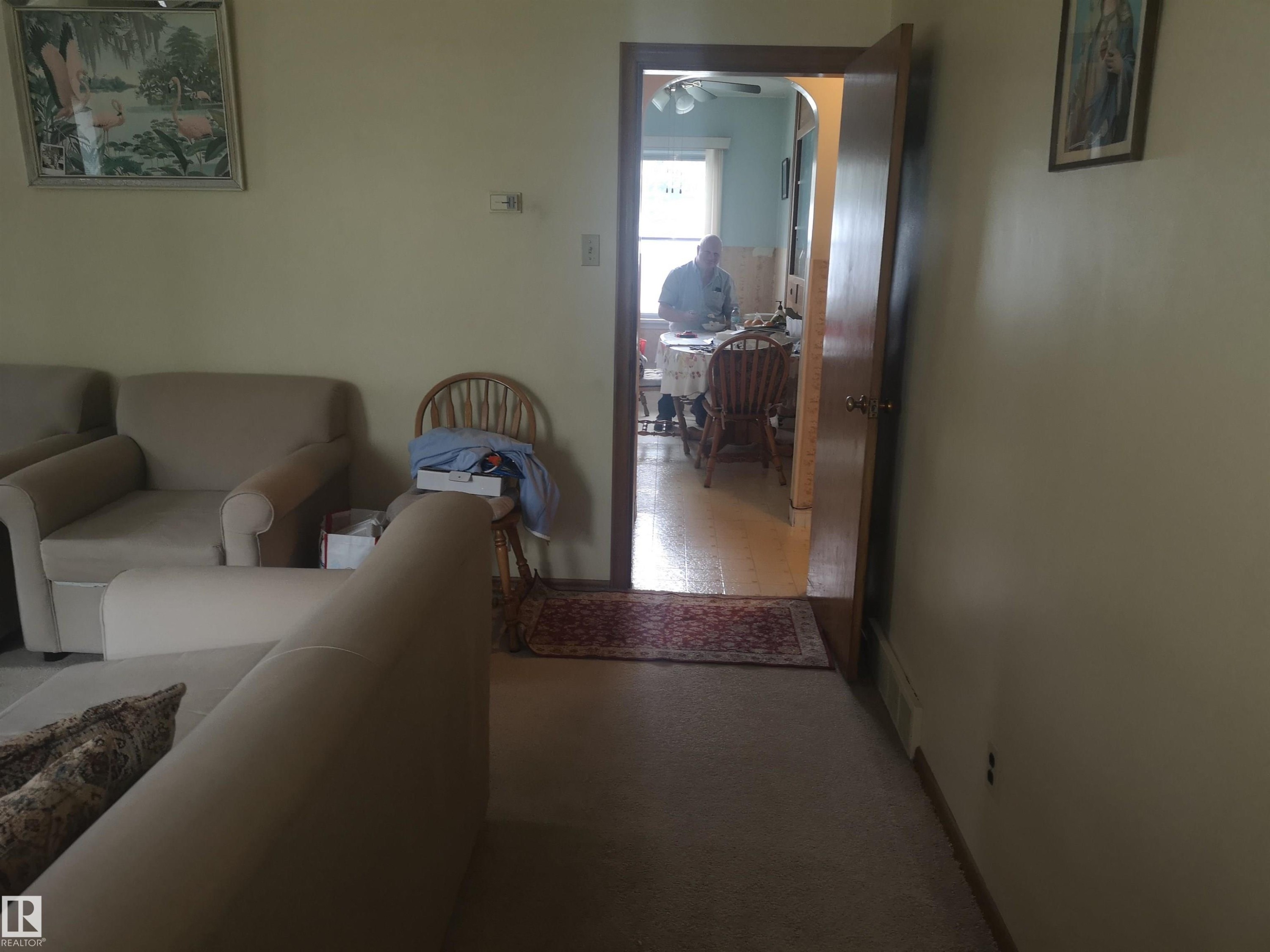 View from front entrance to kitchen. Living room on left - 8751 76 Avenue Nw, Edmonton, AB