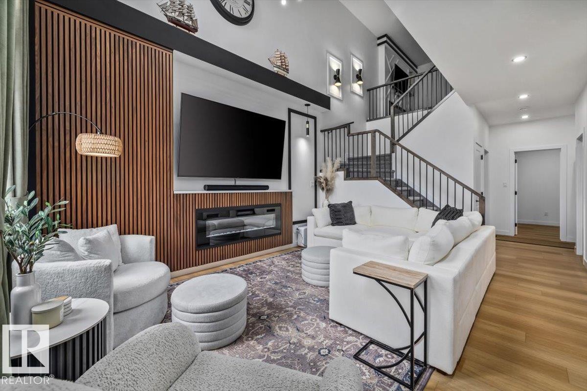 3616 Triomphe Boulevard, Beaumont, AB - Indoor Photo Showing Living Room With Fireplace