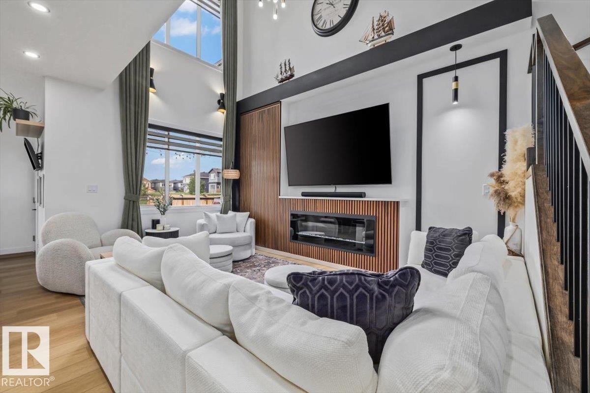3616 Triomphe Boulevard, Beaumont, AB - Indoor Photo Showing Living Room With Fireplace
