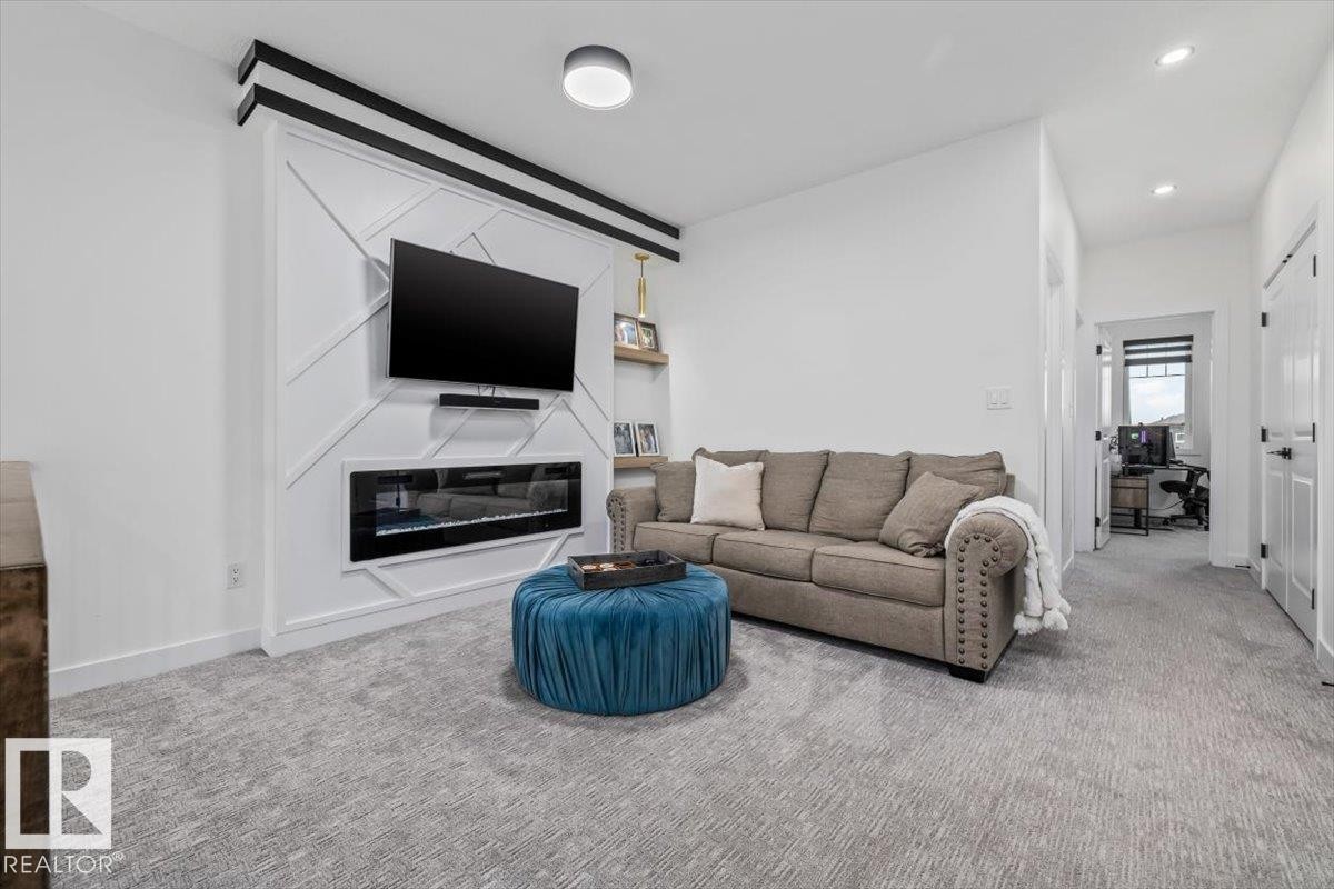 3616 Triomphe Boulevard, Beaumont, AB - Indoor Photo Showing Living Room With Fireplace