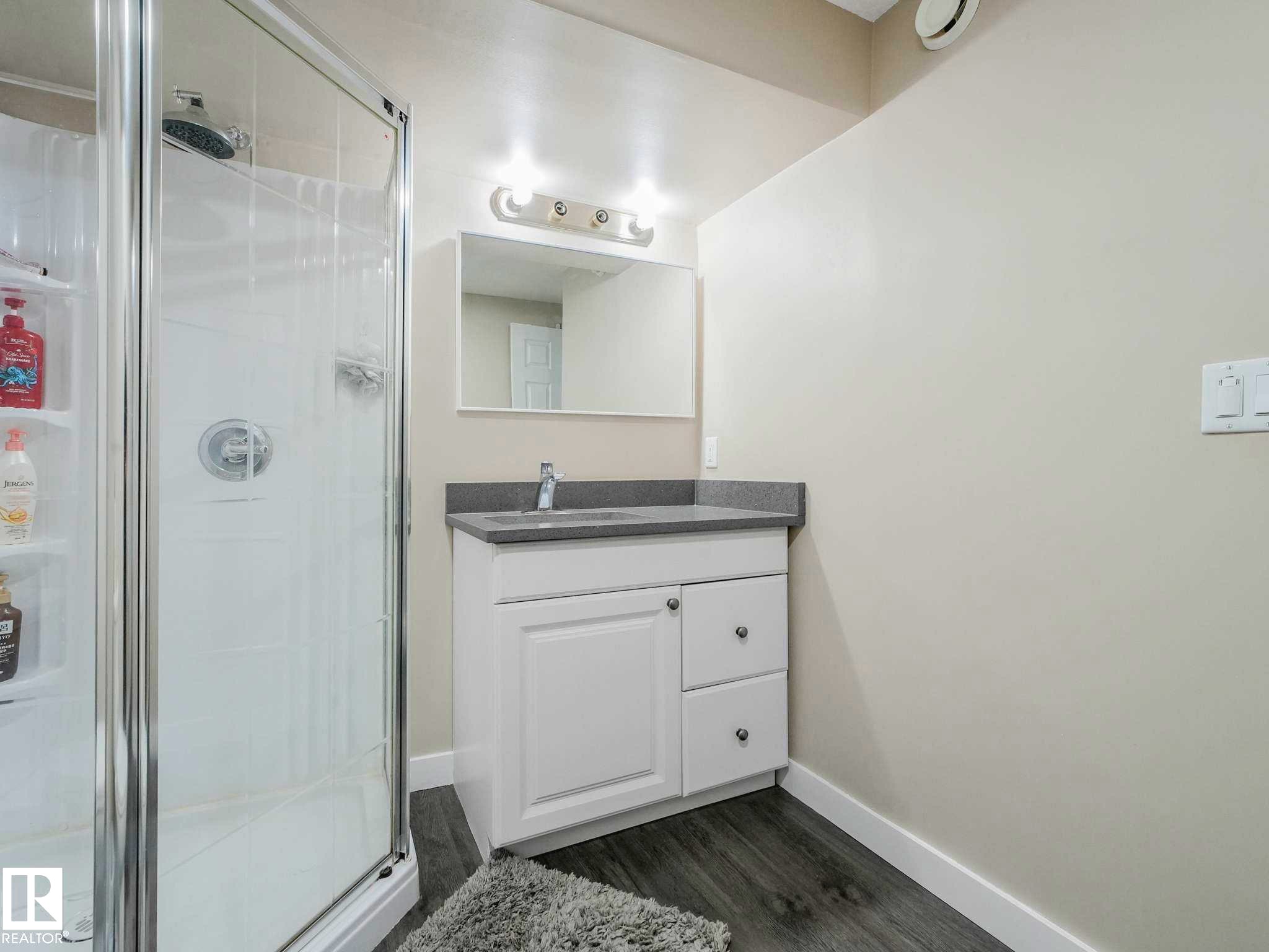 Glass-enclosed shower with a rainfall showerhead - 9207 169 Street, Edmonton, AB - Indoor Photo Showing Bathroom