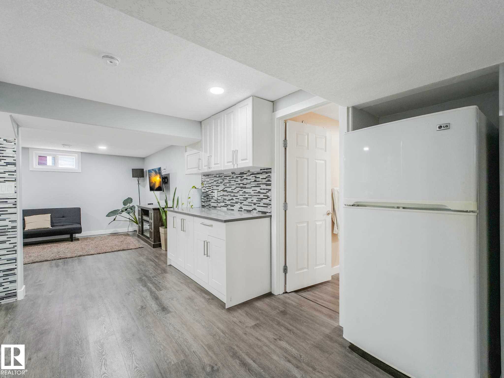 Open concept living area with light wood-finish flooring - 9207 169 Street, Edmonton, AB - Indoor