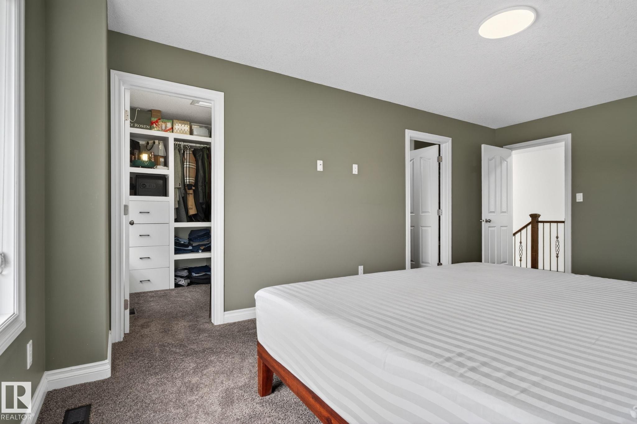 Bedroom featuring neutral wall paint, white trim, and gray carpet - 9628 221 Street, Edmonton, AB