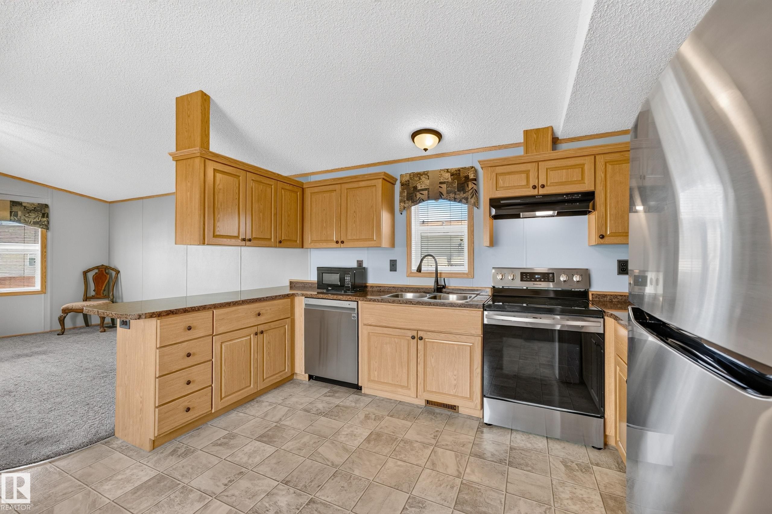 51 Jutland Crescent, Stony Plain, AB - Indoor Photo Showing Kitchen With Stainless Steel Kitchen With Double Sink
