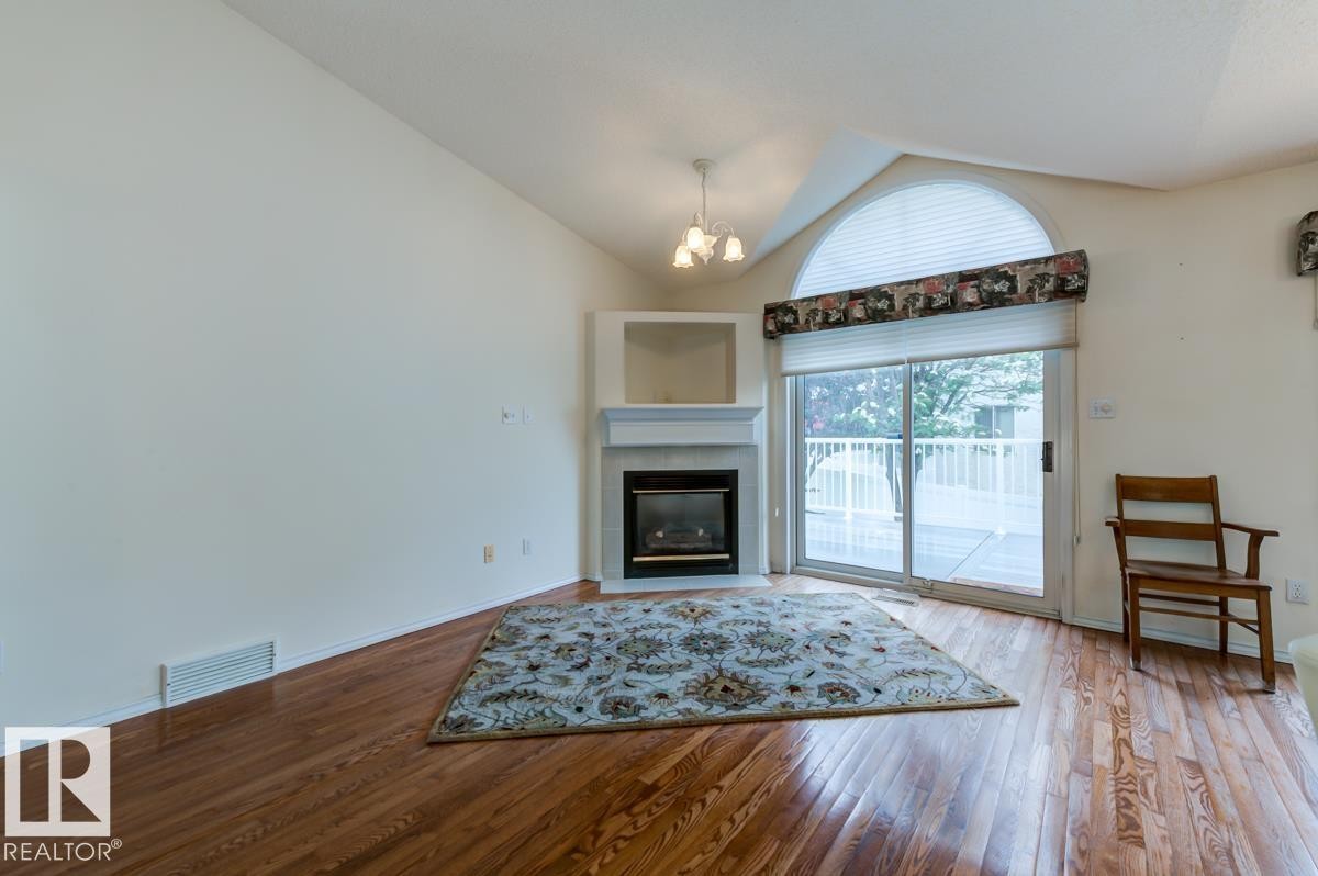 #7 9731 174 St Nw, Edmonton, AB - Indoor Photo Showing Living Room With Fireplace