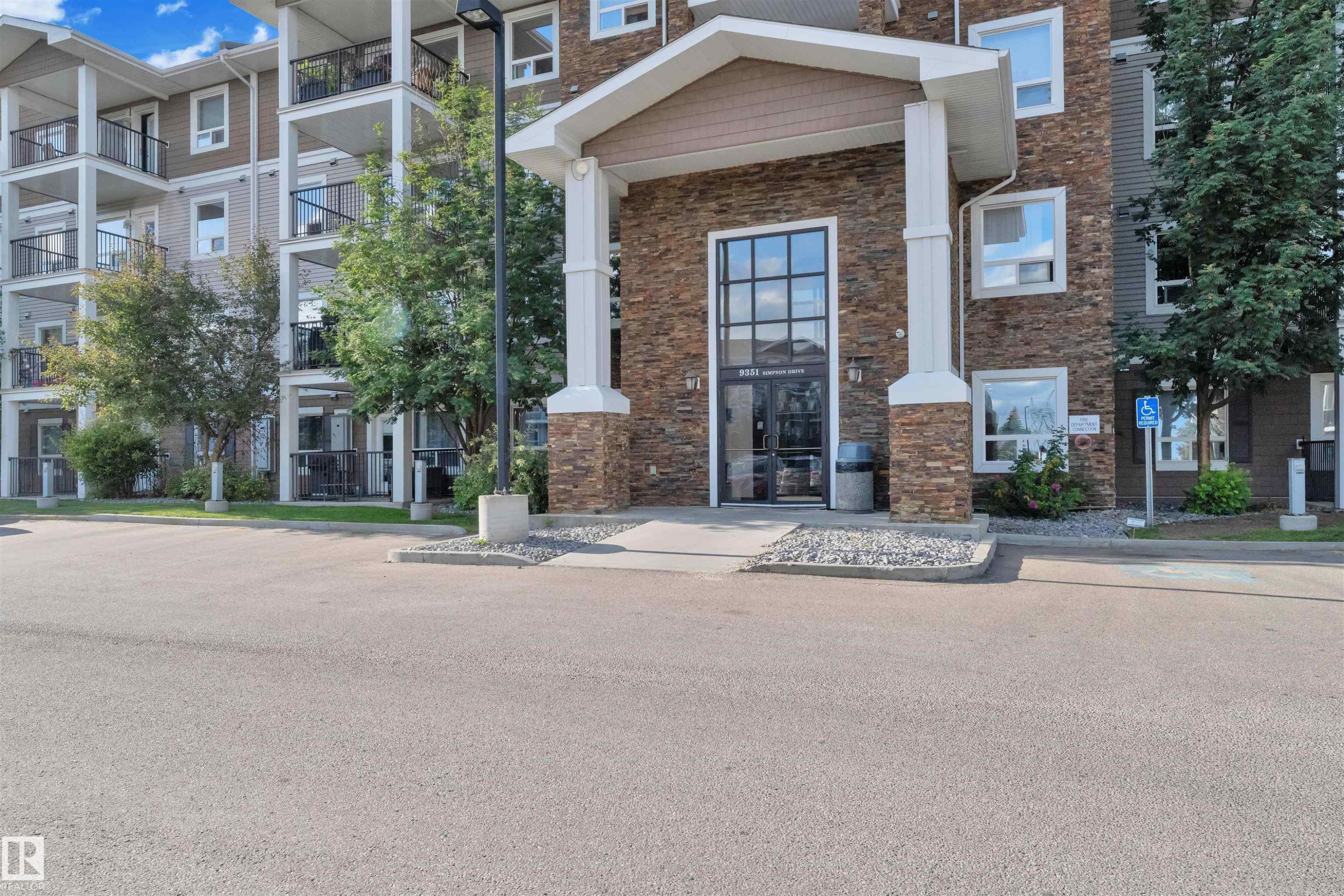 Multi-story building featuring stone and siding exterior - #3302 9351 Simpson Dr Nw, Edmonton, AB