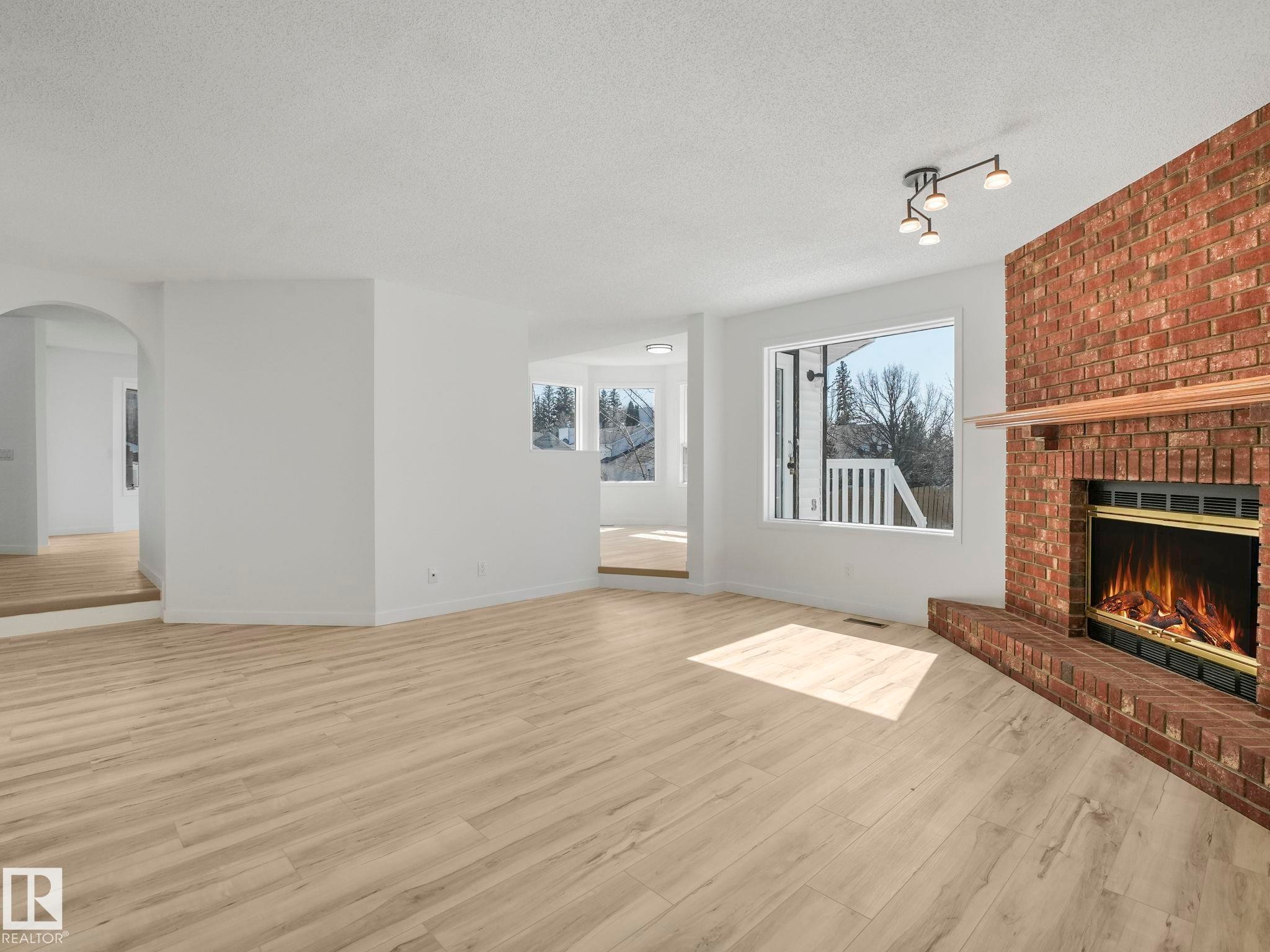 4103 28 Avenue Nw, Edmonton, AB - Indoor Photo Showing Living Room With Fireplace