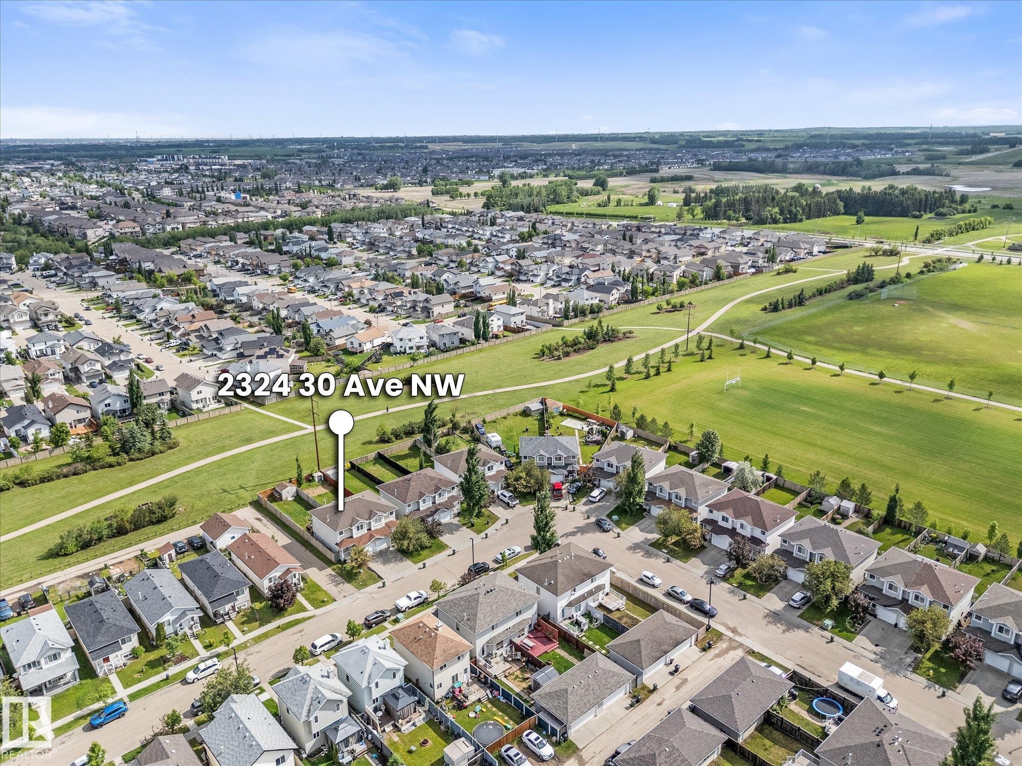 Aerial perspective showcasing a residential neighborhood with varied housing styles - 2324 30 Avenue, Edmonton, AB