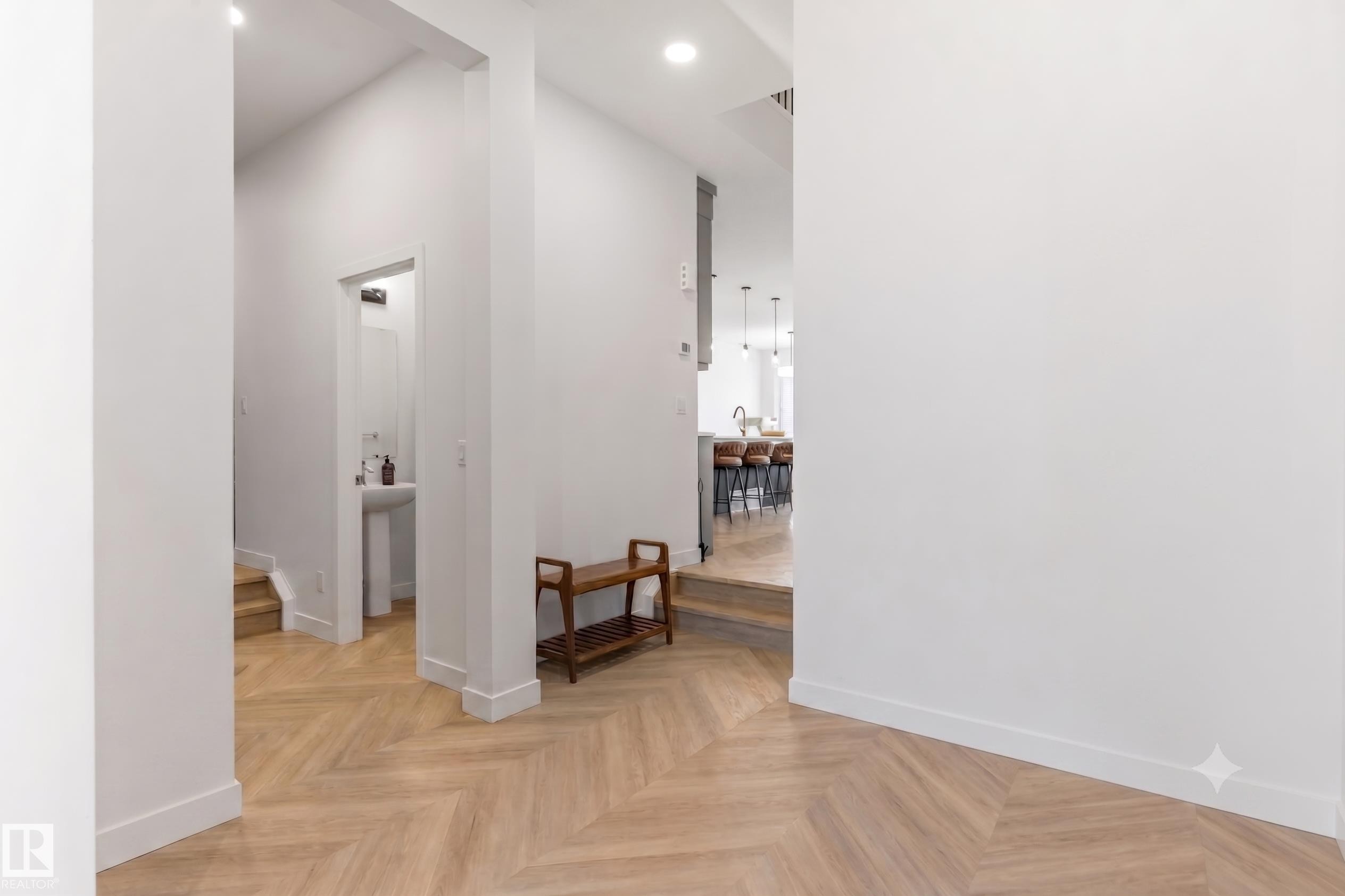 Herringbone wood-finish flooring throughout the entryway - 117 Paisley Gate Gate, Edmonton, AB