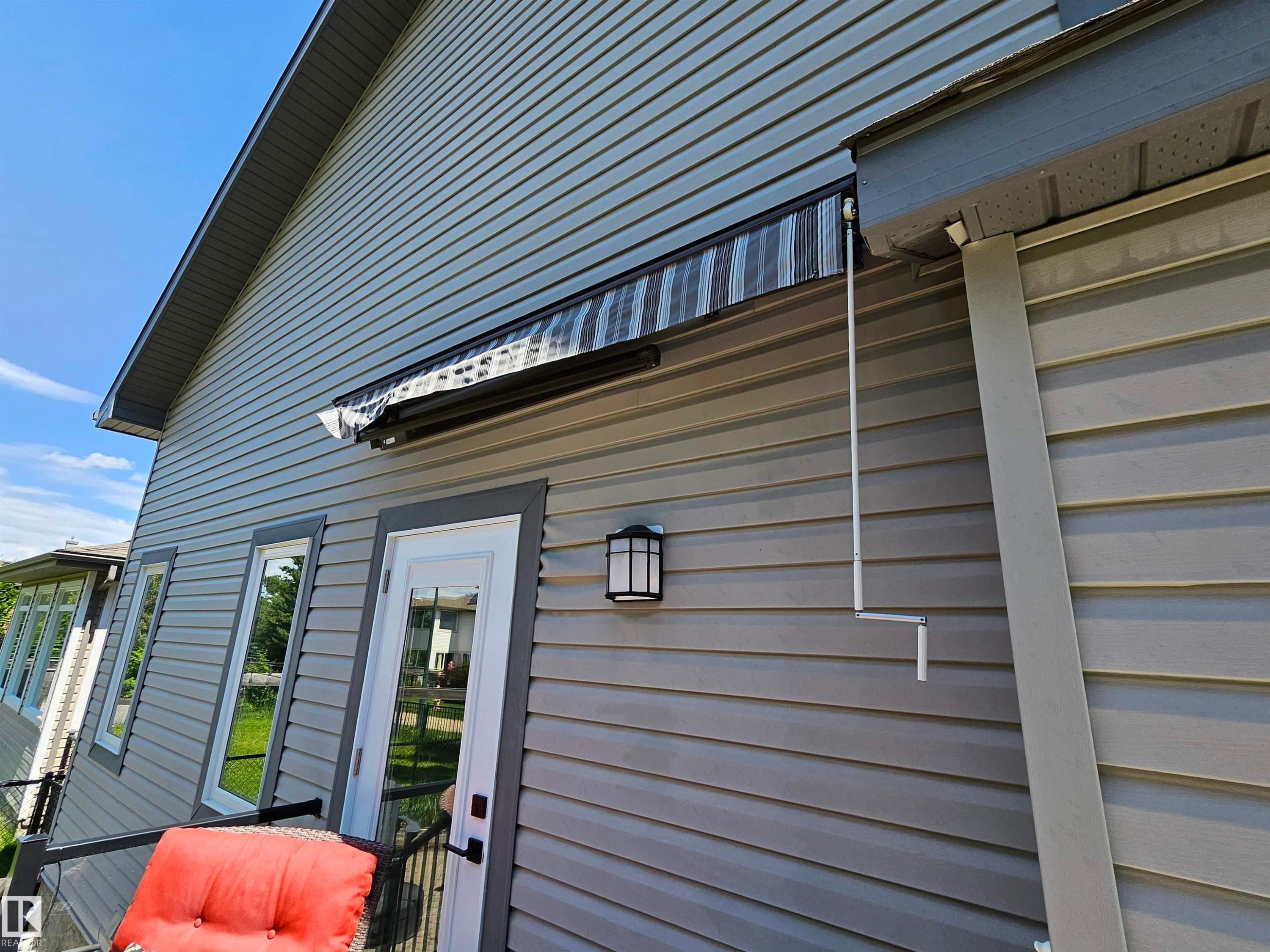 Exterior siding in a neutral tone with white trim - 2322 Rutherford Way, Edmonton, AB