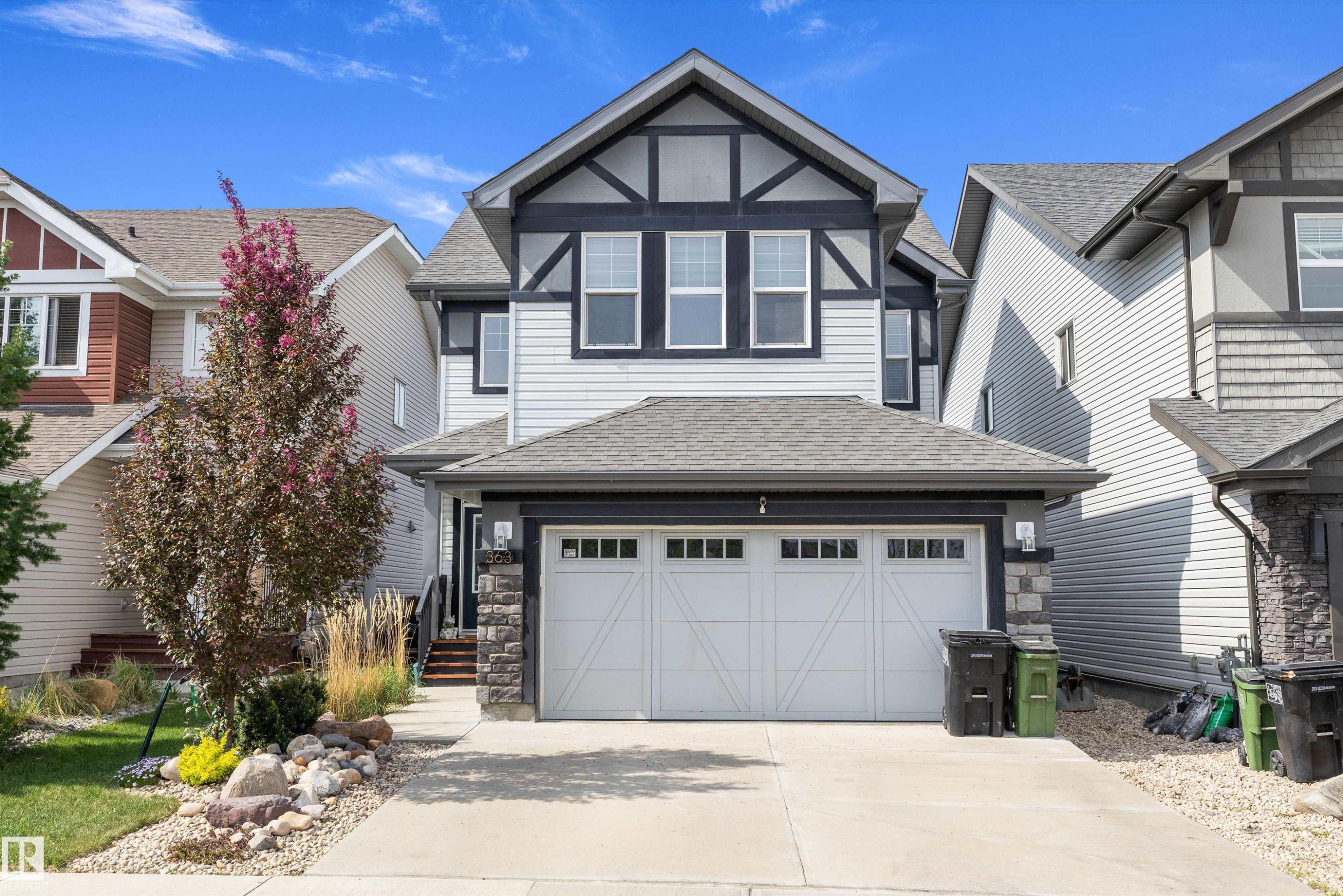 Two-story exterior with light gray siding and dark trim accents - 363 Cy Becker Boulevard, Edmonton, AB - Outdoor With Facade